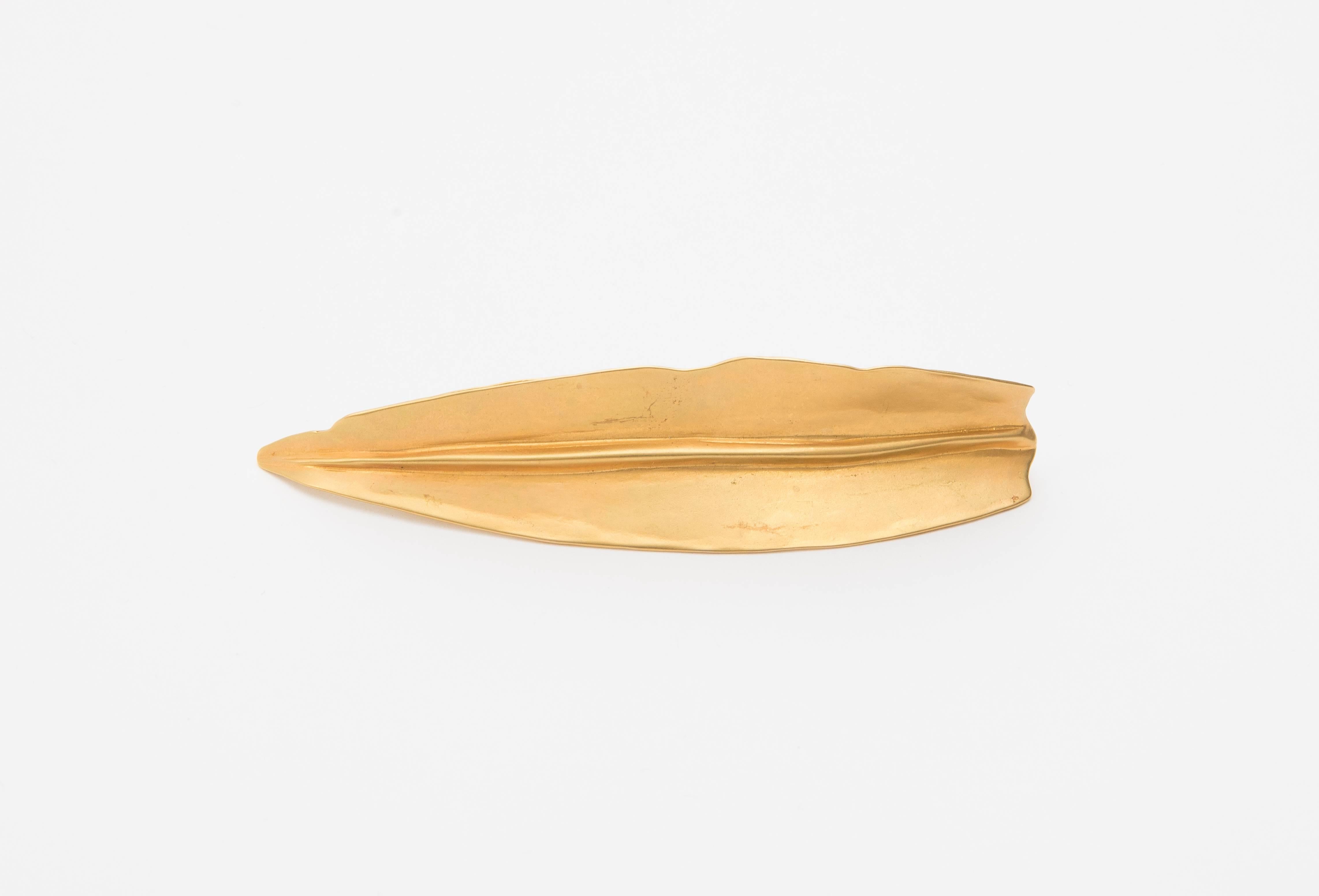 Robert Lee Morris, Circa 1990's brushed gold gilt metal brooch.

Length 4.5, Width 1