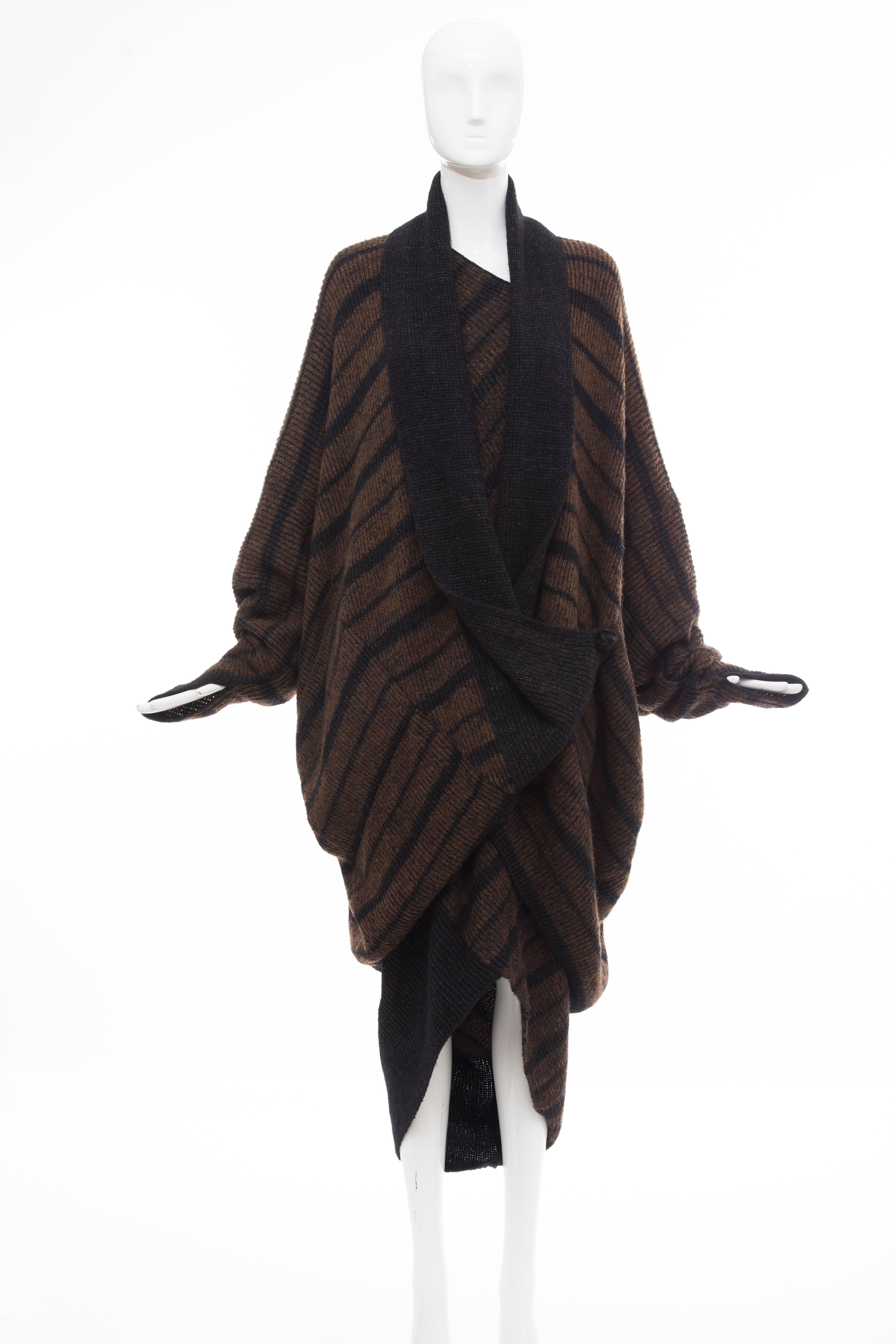 Issey Miyake, Circa 1970's sweater dress and cocoon cardigan ensemble. Wool long sleeve sweater dress with geometric neckline, striped pattern, tapered hem and tonal stitching throughout with long sleeve cocoon cardigan with striped pattern,