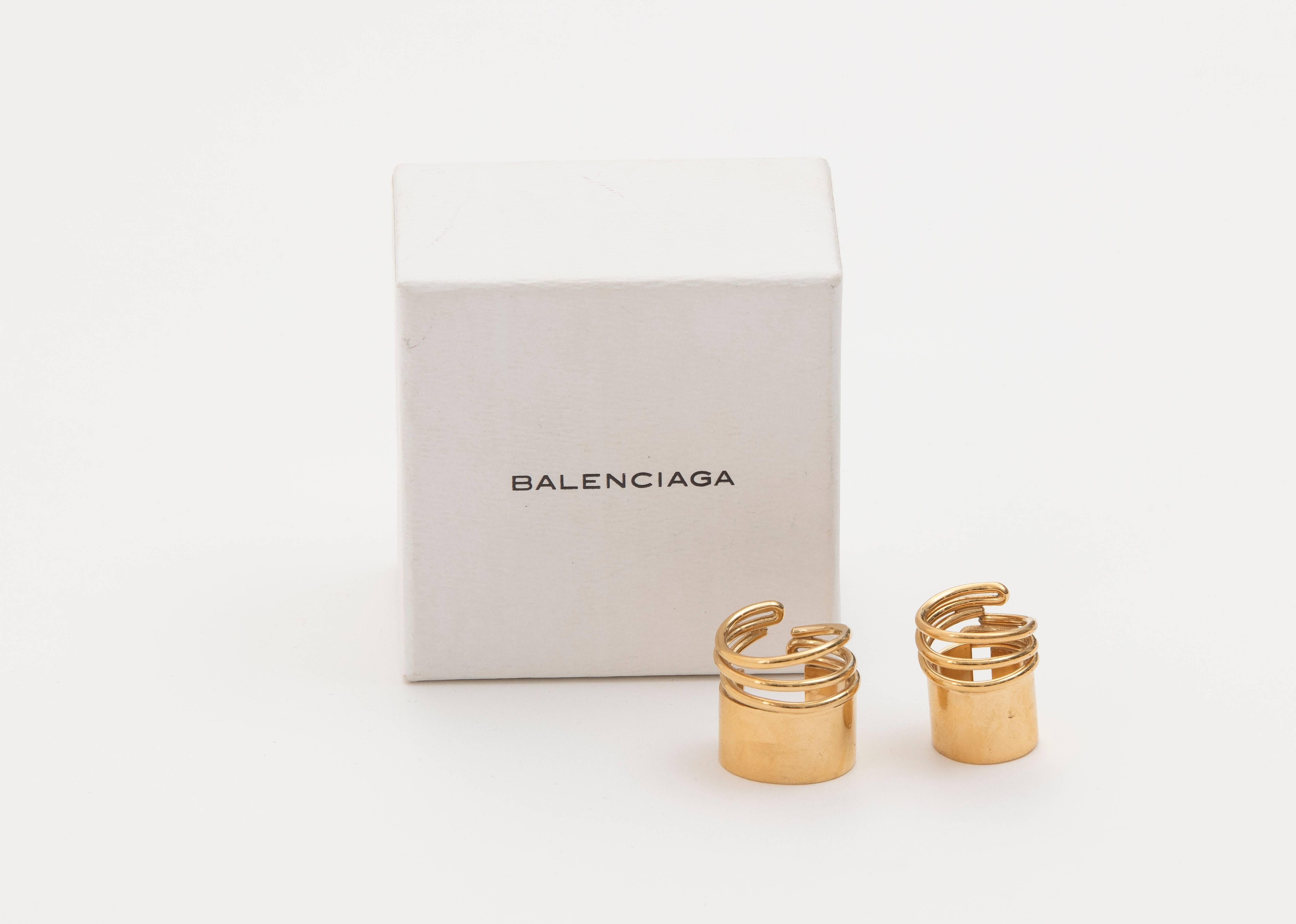 Balenciaga by Nicolas Ghesquière, Spring-Summer 2013 two gold tone brass coil rings designed by Charlotte Chesnais.  Comes in original box and pouch.

Size 5
Size 3.5