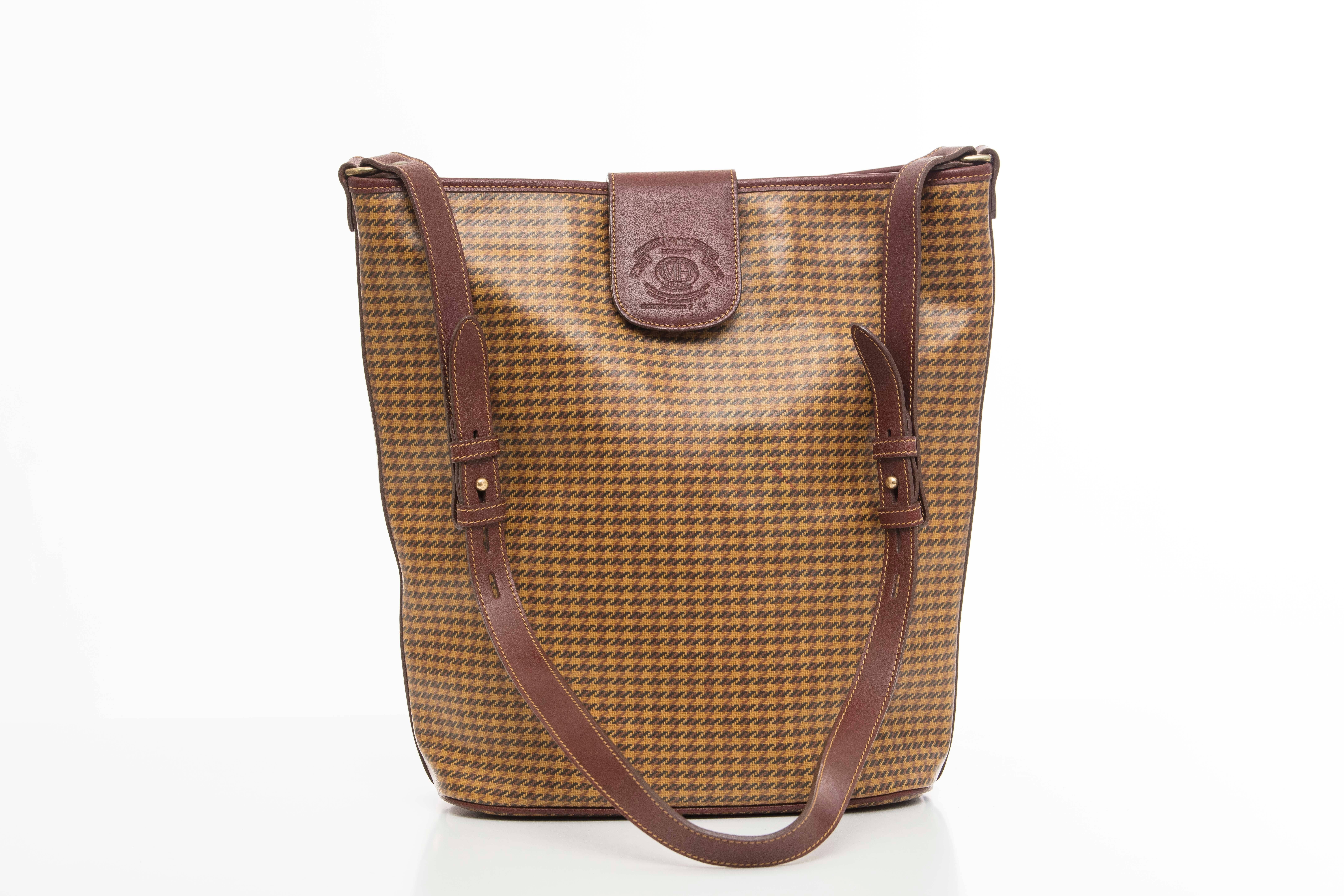 Ghurka Marley Hodgson check shoulder bag with snap front, adjustable strap and one interior zip pocket.

Width 13, Length 13, Depth 5