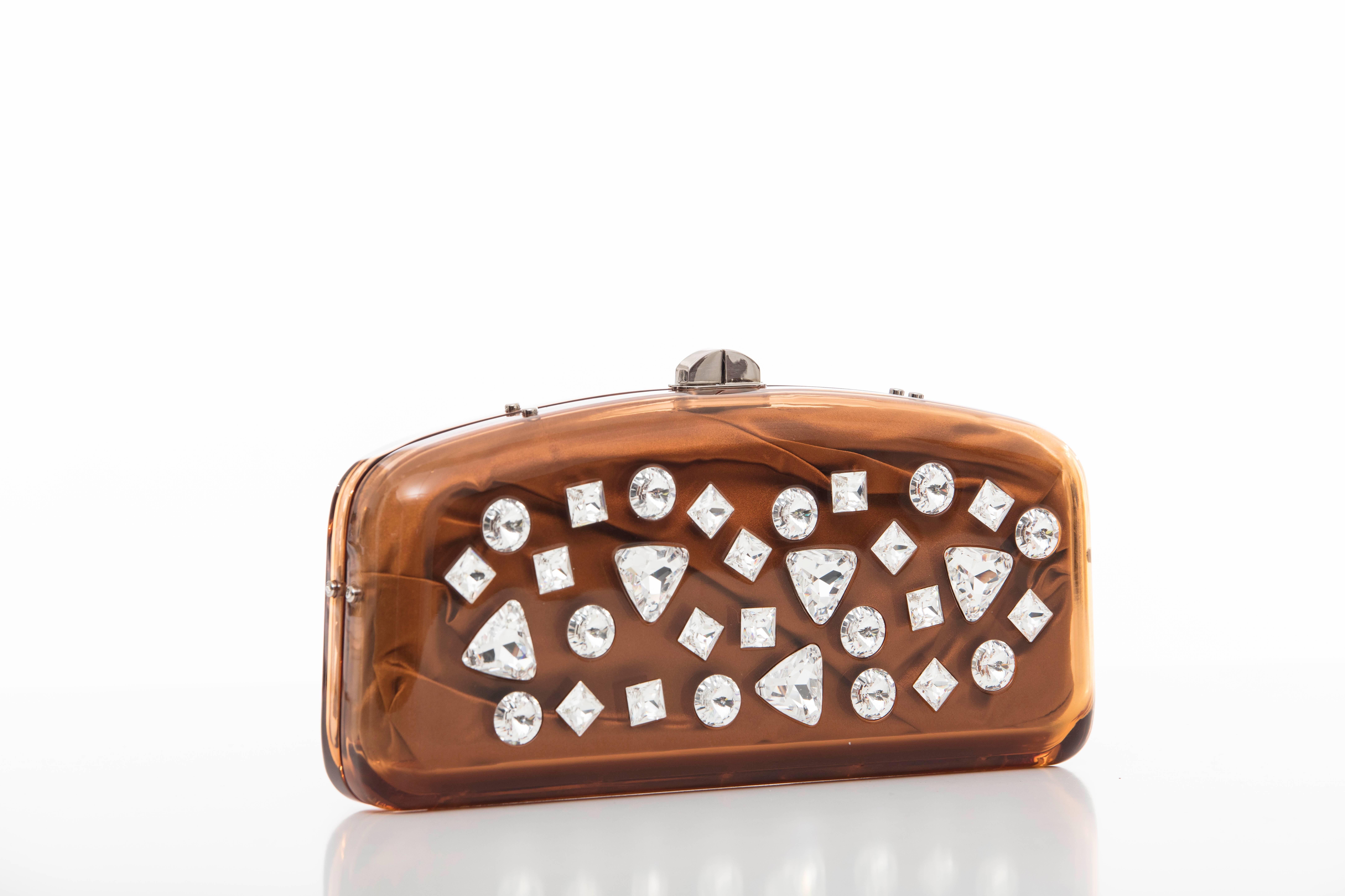 Tom Ford for Yves Saint Laurent, Autumn-Winter 2003 runway copper lucite crystal clutch with silver tone hardware, kiss lock closure and tonal satin lining.

Height: 5, Width 10, Depth 1.5

