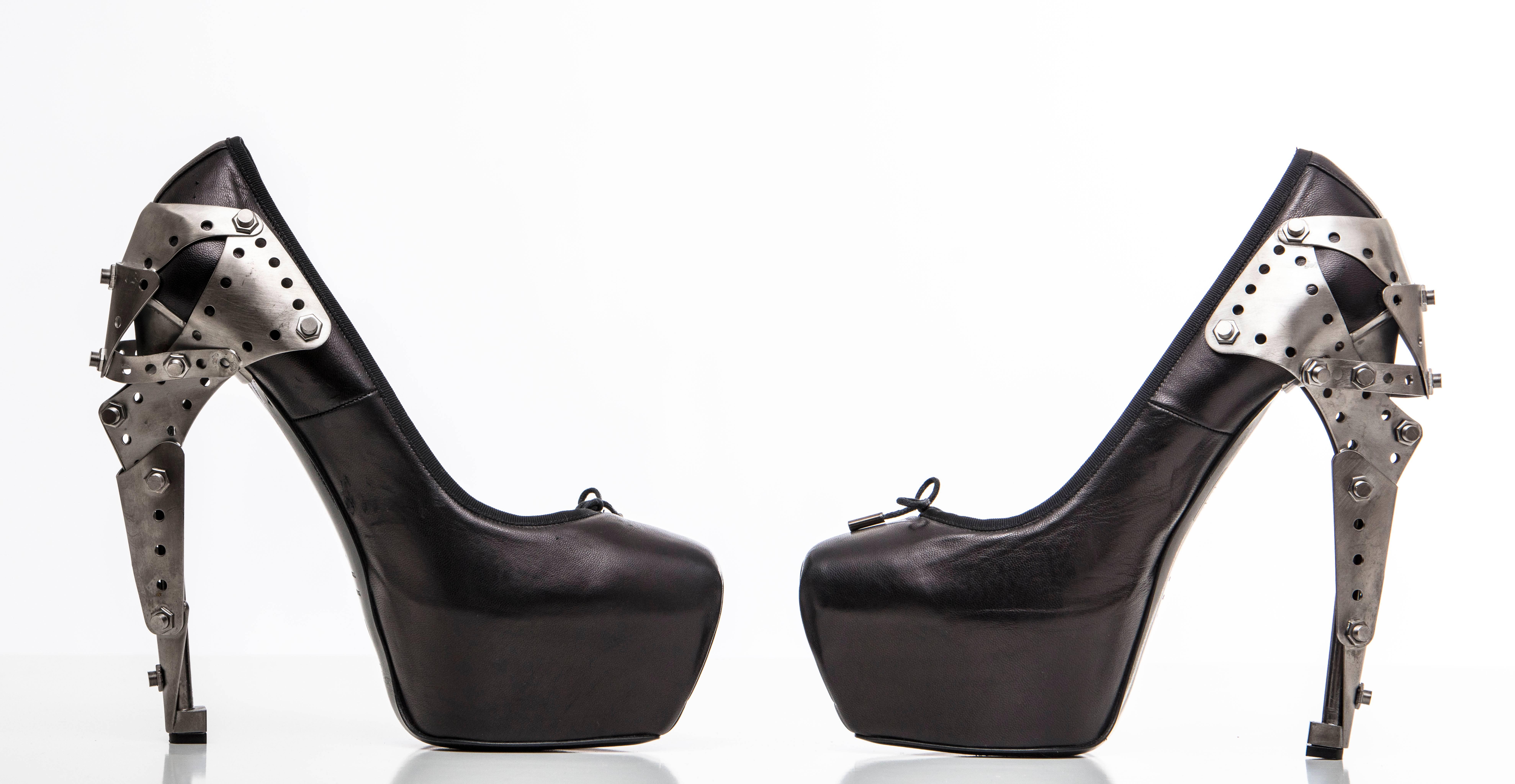 Alexander McQueen, Spring-Summer 2010, Plato's Atlantis Collection black leather Titanic ballerina pump.

IT.41
US. 11
Heels: 7, Platforms 2

