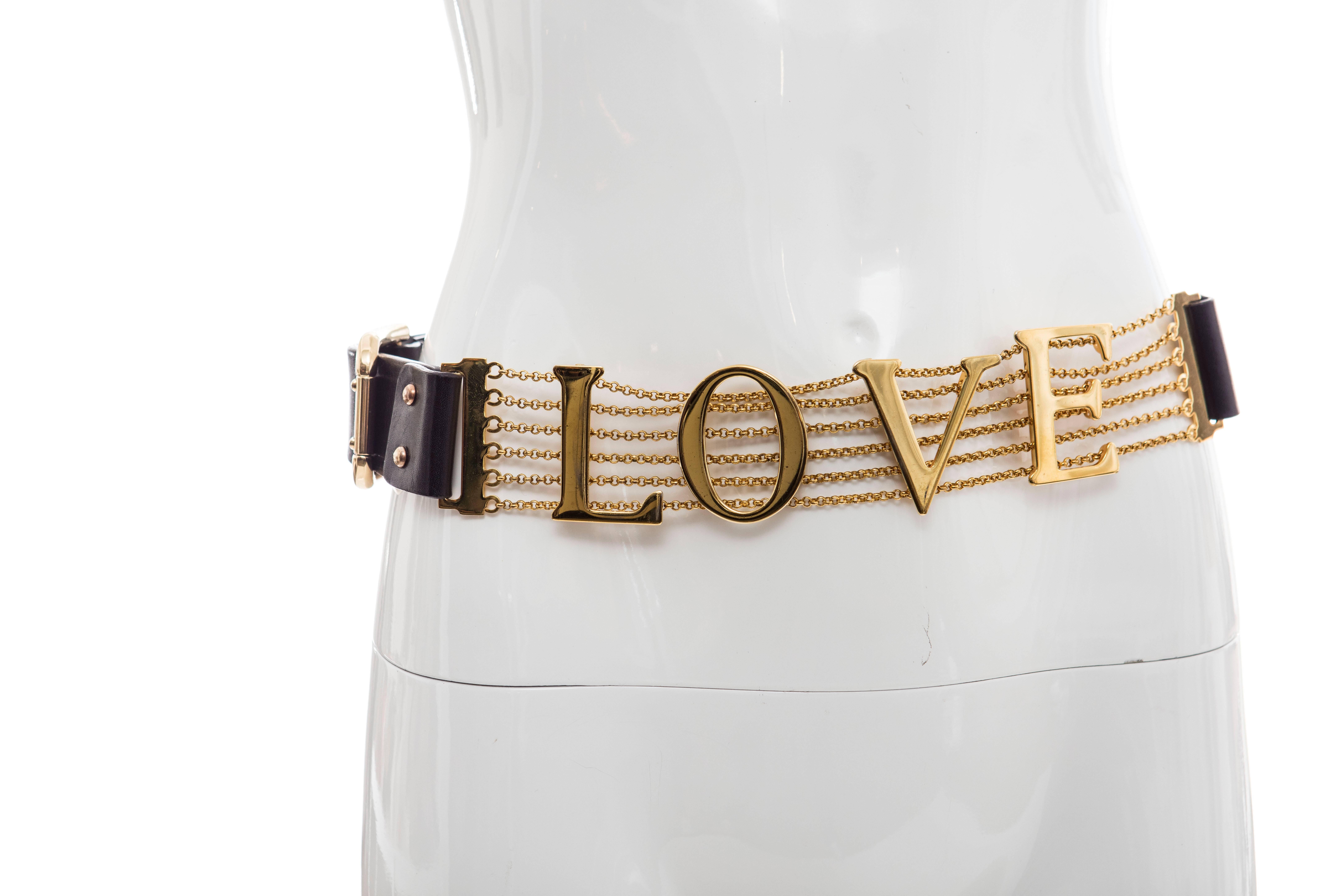  Dolce & Gabbana, Spring-Summer 2003 black leather belt with gold-tone hardware, chain-link embellishment at trim featuring 'LOVE' adornment and buckle closure.

Length Min: 32.25