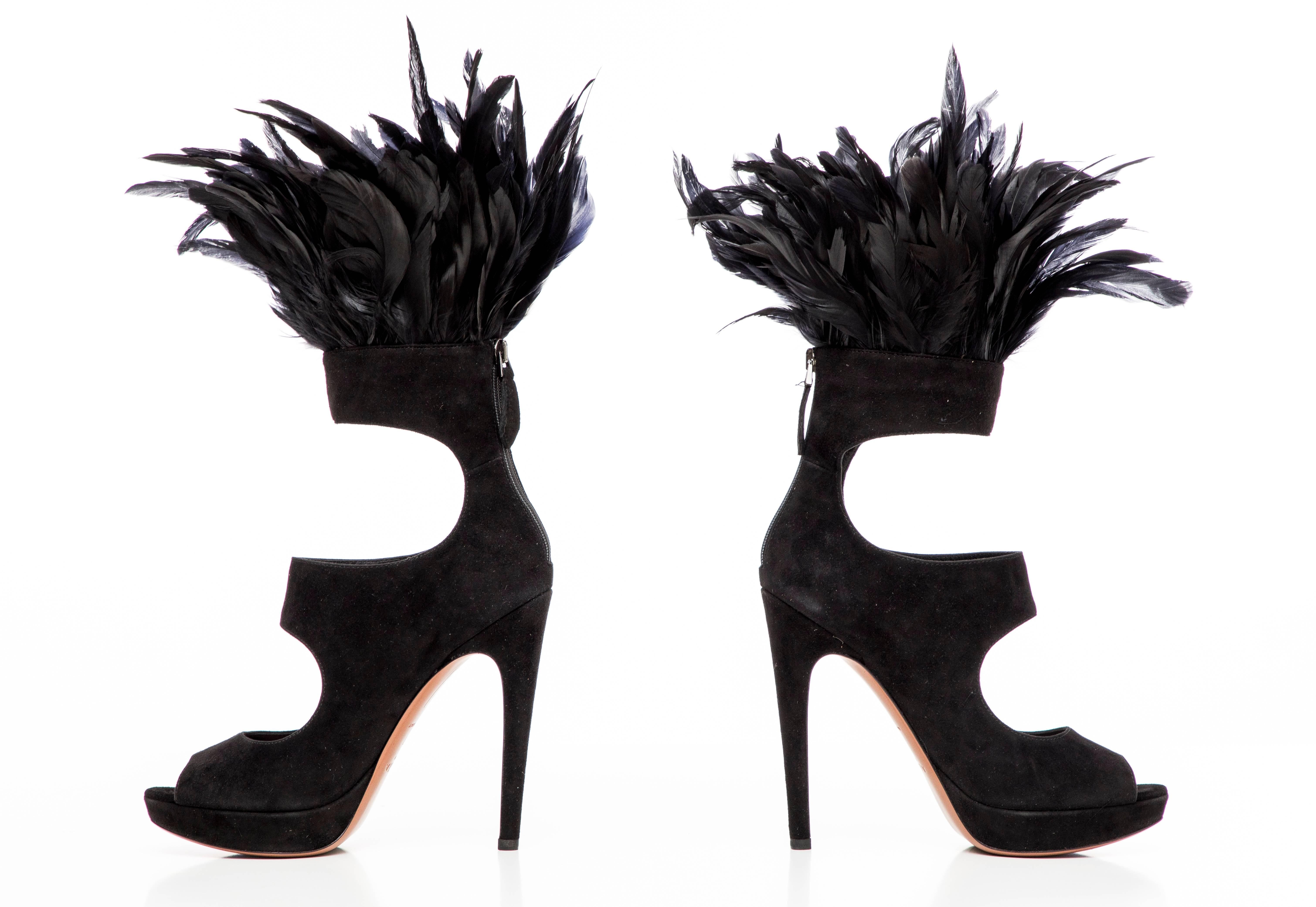 Azzedine Alaïa, Fall 2010 black suede peep-toe platform pumps with cutouts throughout, covered heels and feather trim at uppers. Includes box and dust bag. 

IT. 37
Us. 7

Heels: 5.25, Platforms: 1
