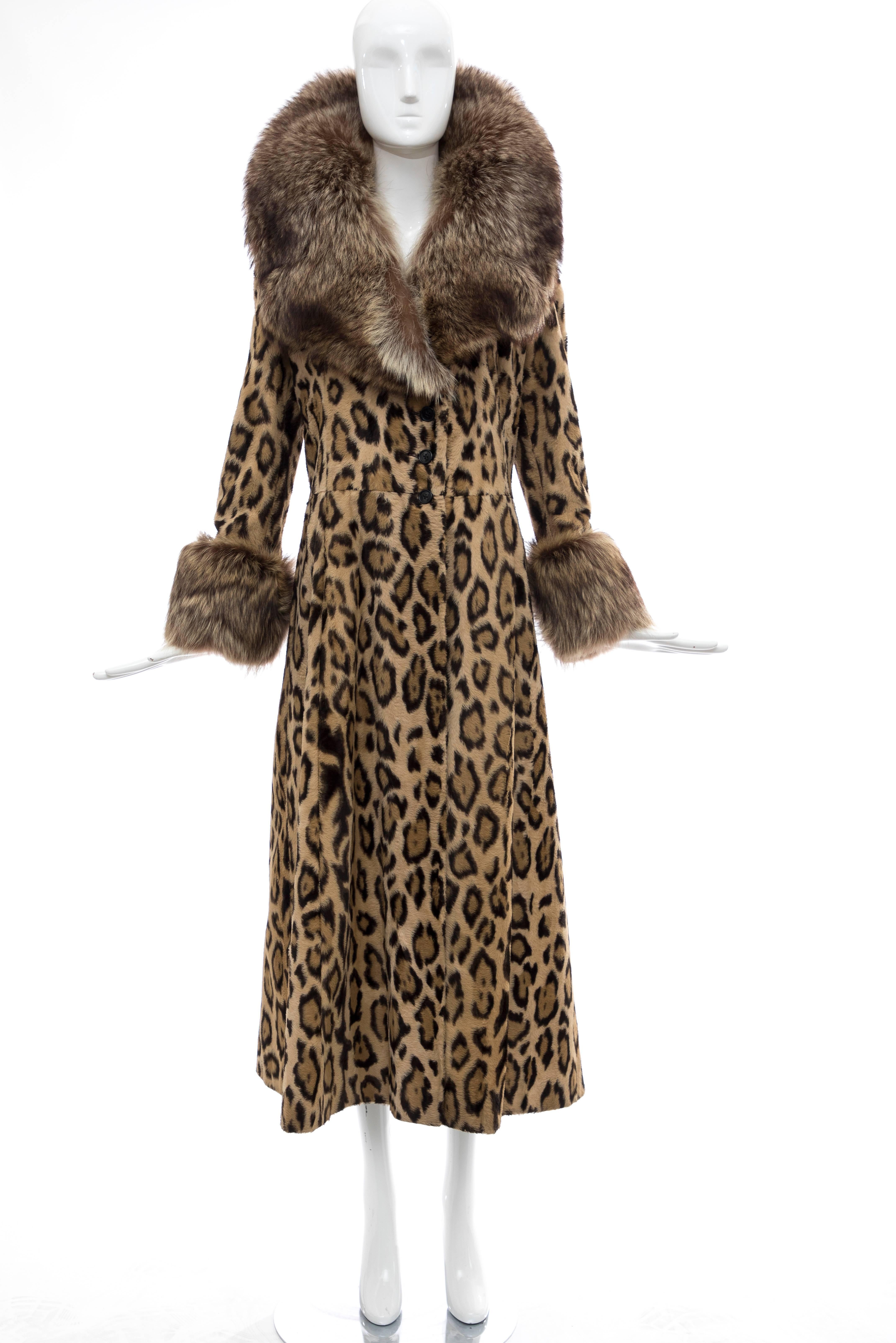 Goldring's Couture, Circa: 1970's faux leopard button front maxicoat with dramatic racoon fur collar and cuffs, two front pockets and fully lined in satin.

No Size Label

Bust: 37, Waist: 34, Hips: 50, Sleeve: 24, Shoulder: 16, Length: 50.5