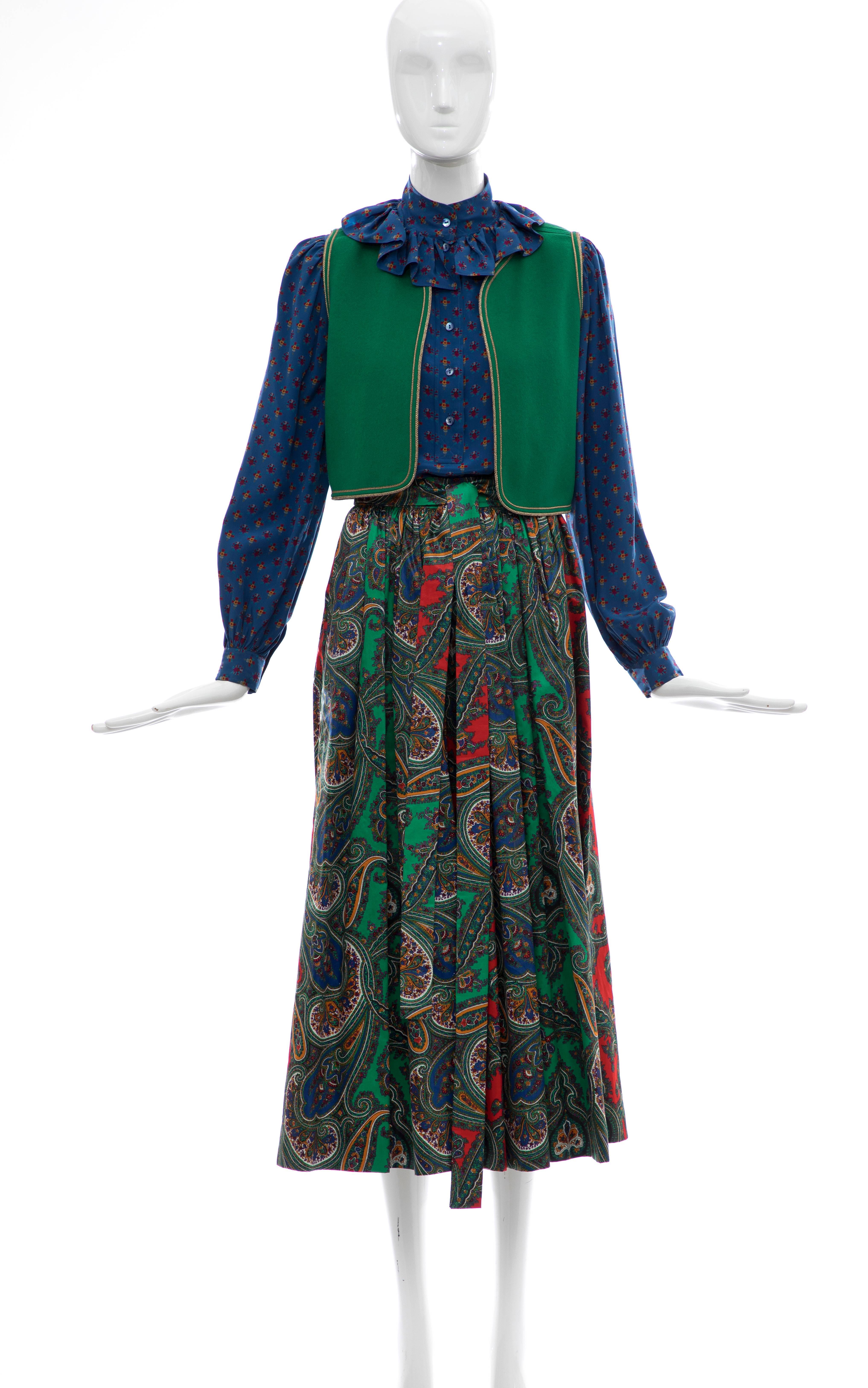 Yves Saint Laurent Rive Gauche, circa 1970s silk printed blouse, wool felted green vest, paisley print cotton sateen skirt  with one left side pocket skirt-suit.

Blouse: EU. 36, Bust 36, Length 23.5, Shoulders 14.5

Skirt: Eu. 34, Waist 22, Length