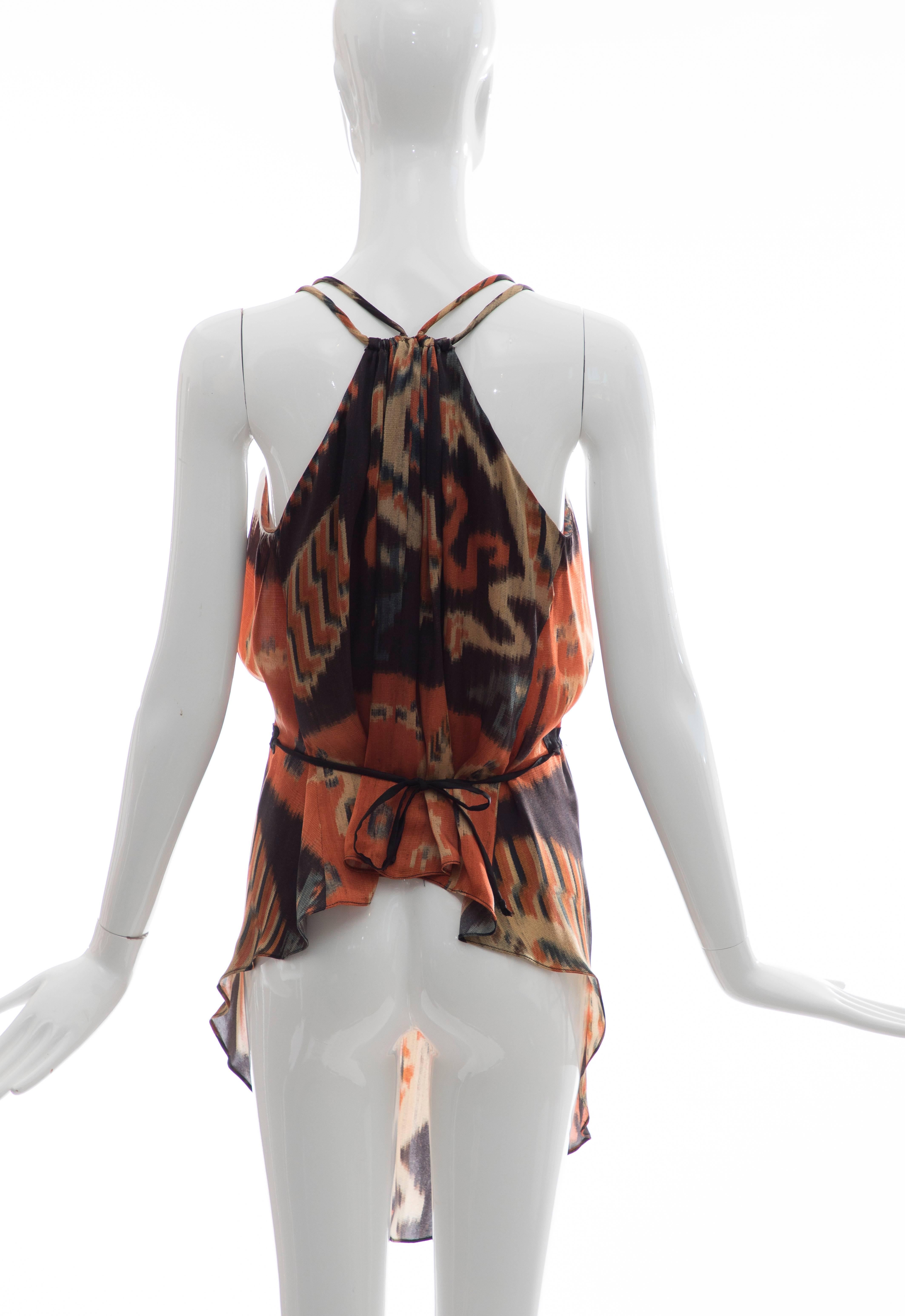 Nicolas Ghesquière for Balenciaga, Autumn-Winter 2007 silk sleeveless top with Ikat print throughout, plunging neckline, dual narrow straps featuring gold-tone embellishments, asymmetrical hem and sash tie closure at waist.

IT. 40
US. 8
Bust: 36,