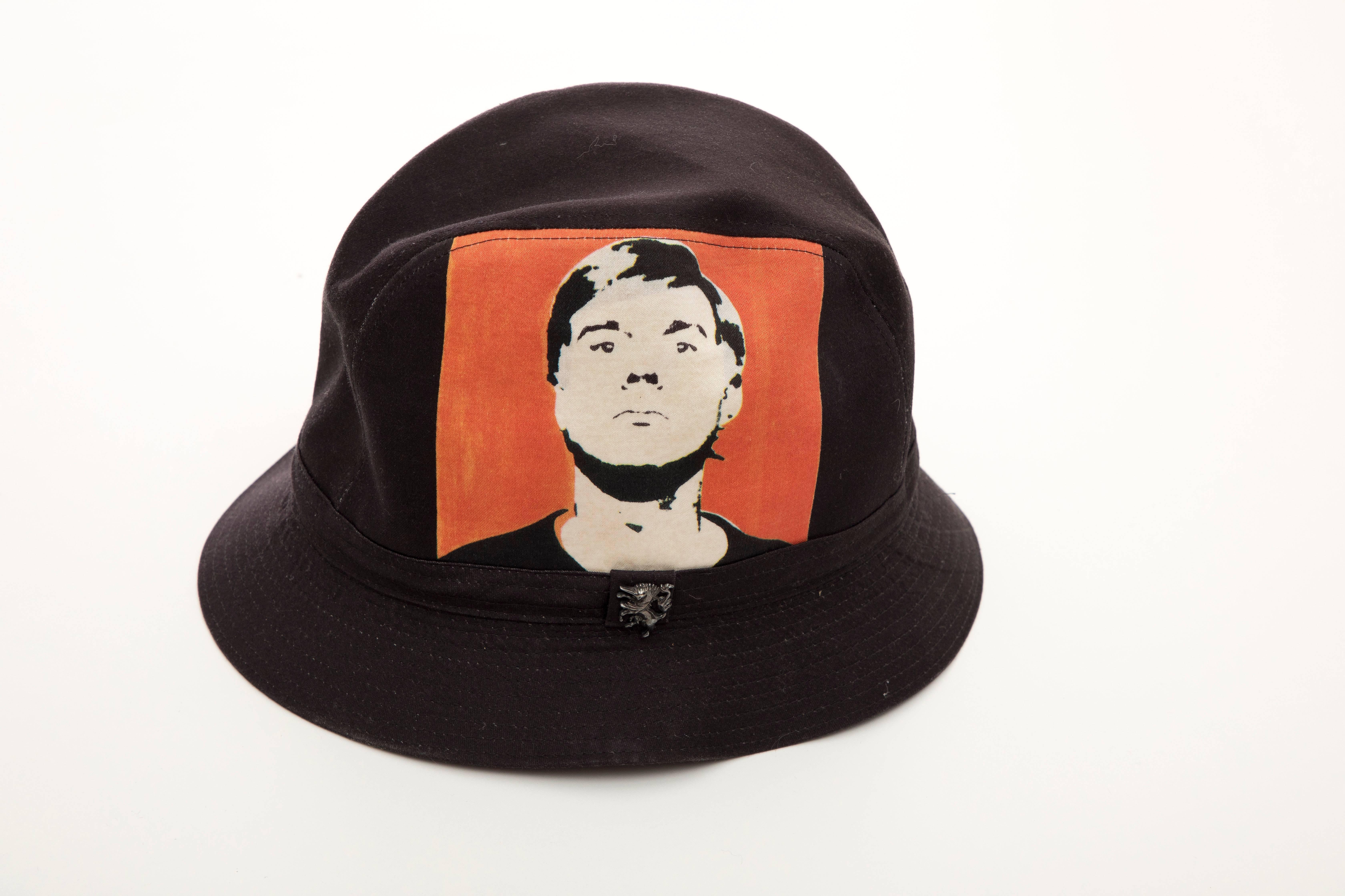 Philip Treacy, Circa 2006 black woven printed cotton Andy Warhol bucket hat lined with iconic Campbell Soup print.

Designer Size: Medium

Circumference: 23, Brim: 1.75
