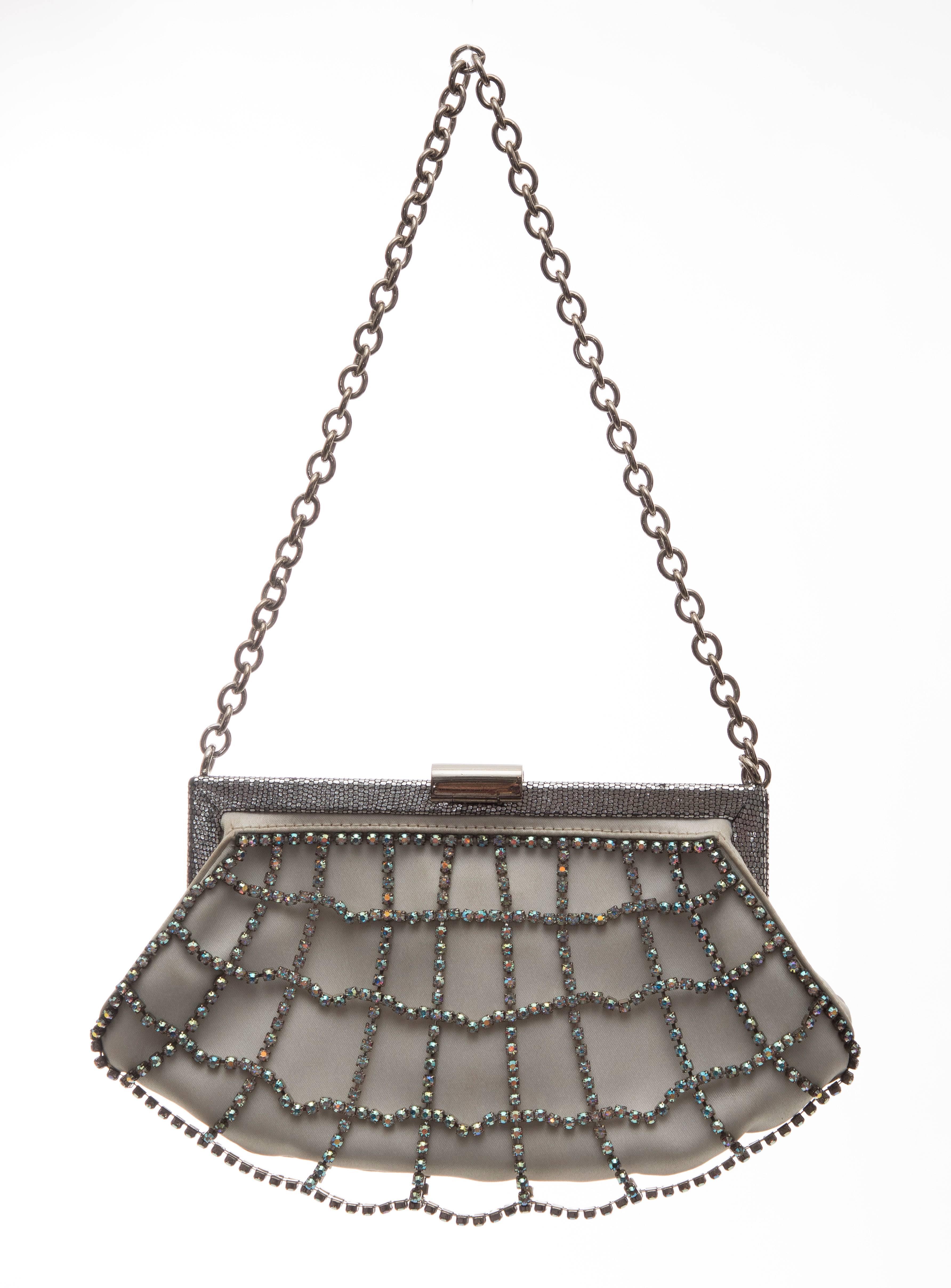 Fendi, Circa: 1990's white silk satin evening bag with silver-tone hardware, single chain-link shoulder strap, aurora borealis crystal embellished overlay at exterior, tonal satin lining and push-lock closure at top.

Shoulder Strap Drop: 8, Height