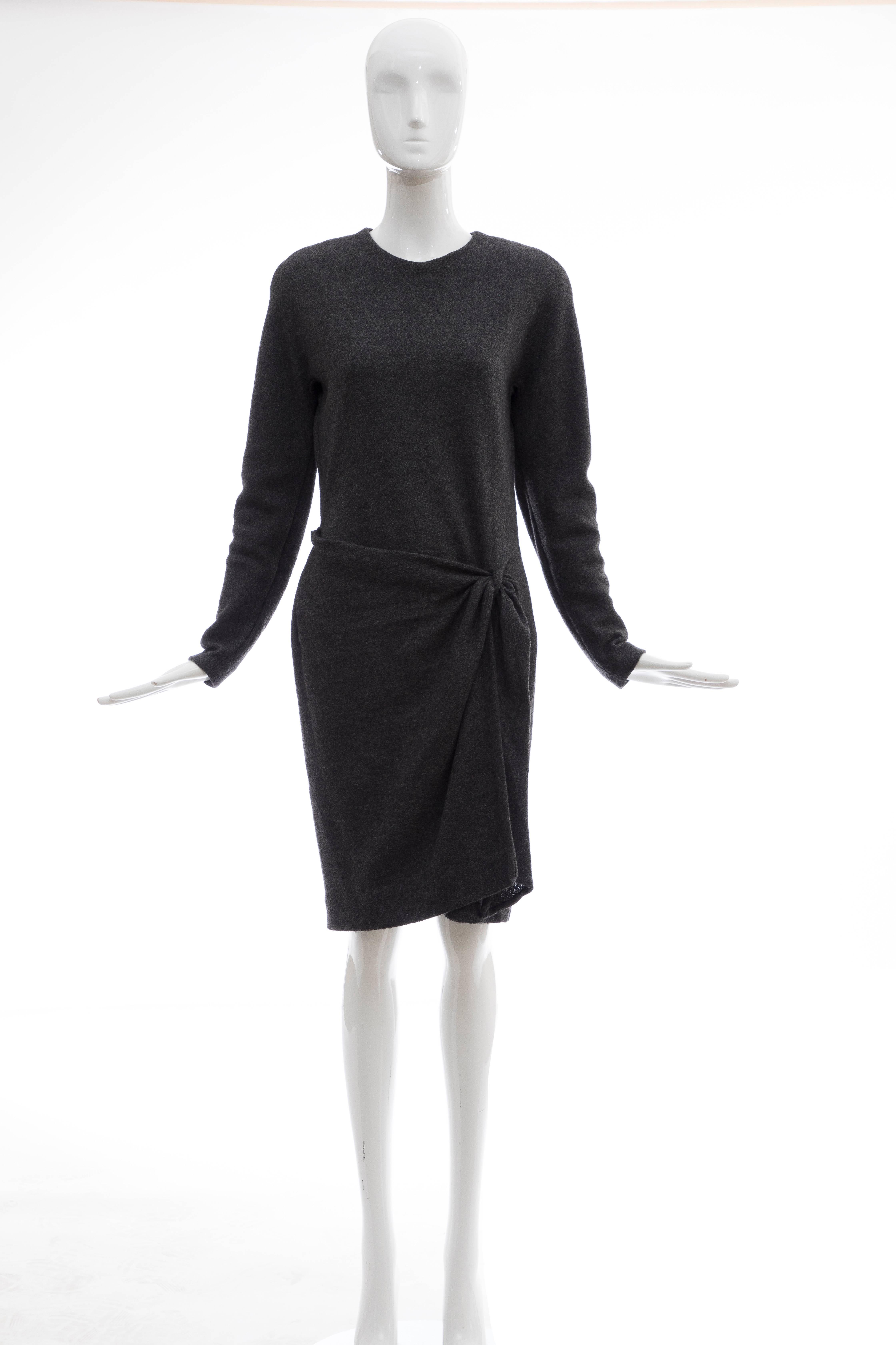 Donna Karan, Circa 1980's Alpaca Wool Crepe Jersey Charcoal Grey long sleeve wrap dress with jewel neckline, back zip and fully lined.

Bust 36, Waist 28, Hips 33, Length 39.5

US. 10 fits a modern size 8