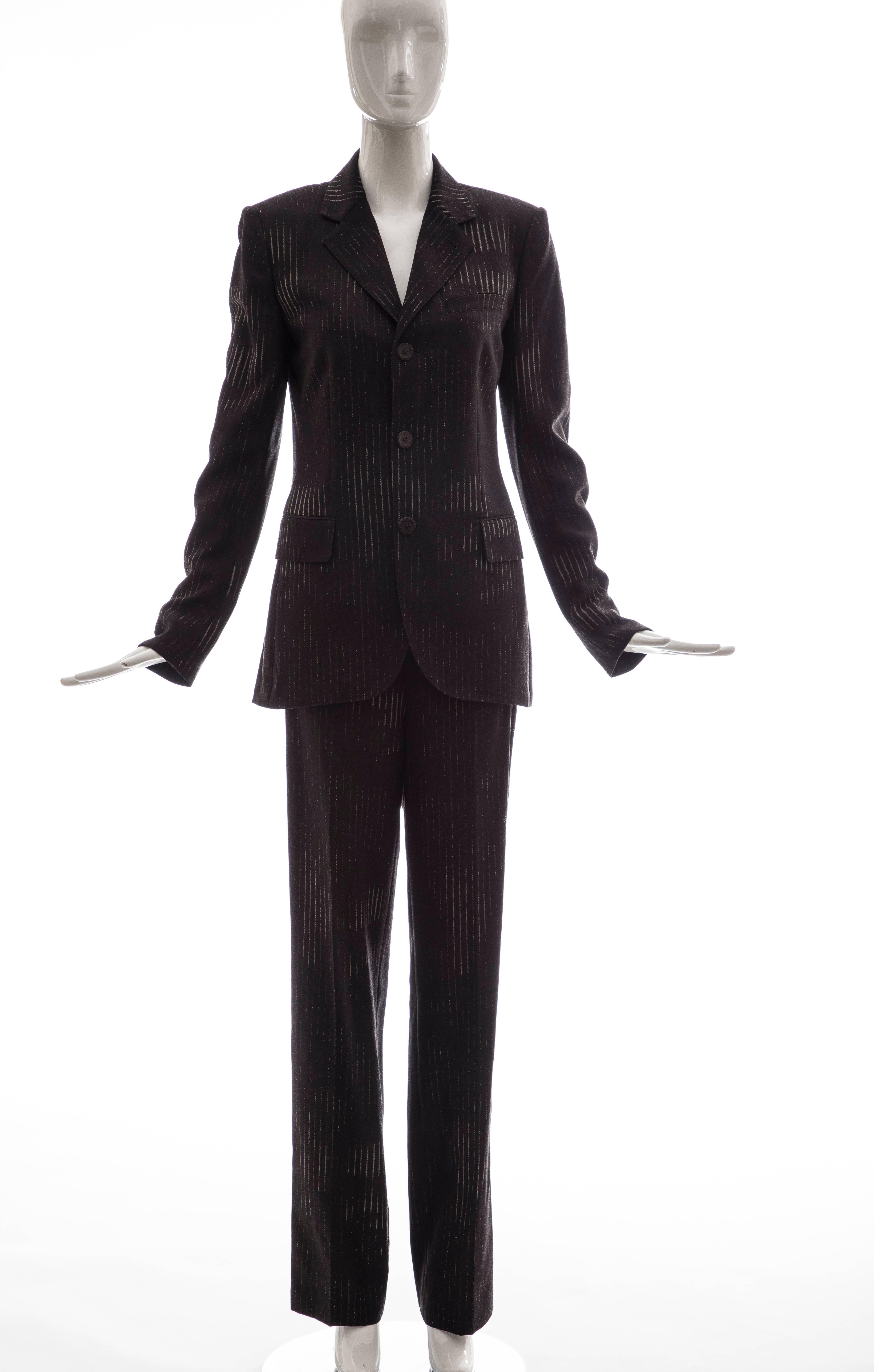 Jean Paul Gaultier, Circa 1990's 3D printed faces, wool chacoal grey pinstripe pantsuit with button front jacket, two front faux pockets, fully lined in silk with side zip pant.

IT. 42, US 8, FR 38, GB 10, D 38



