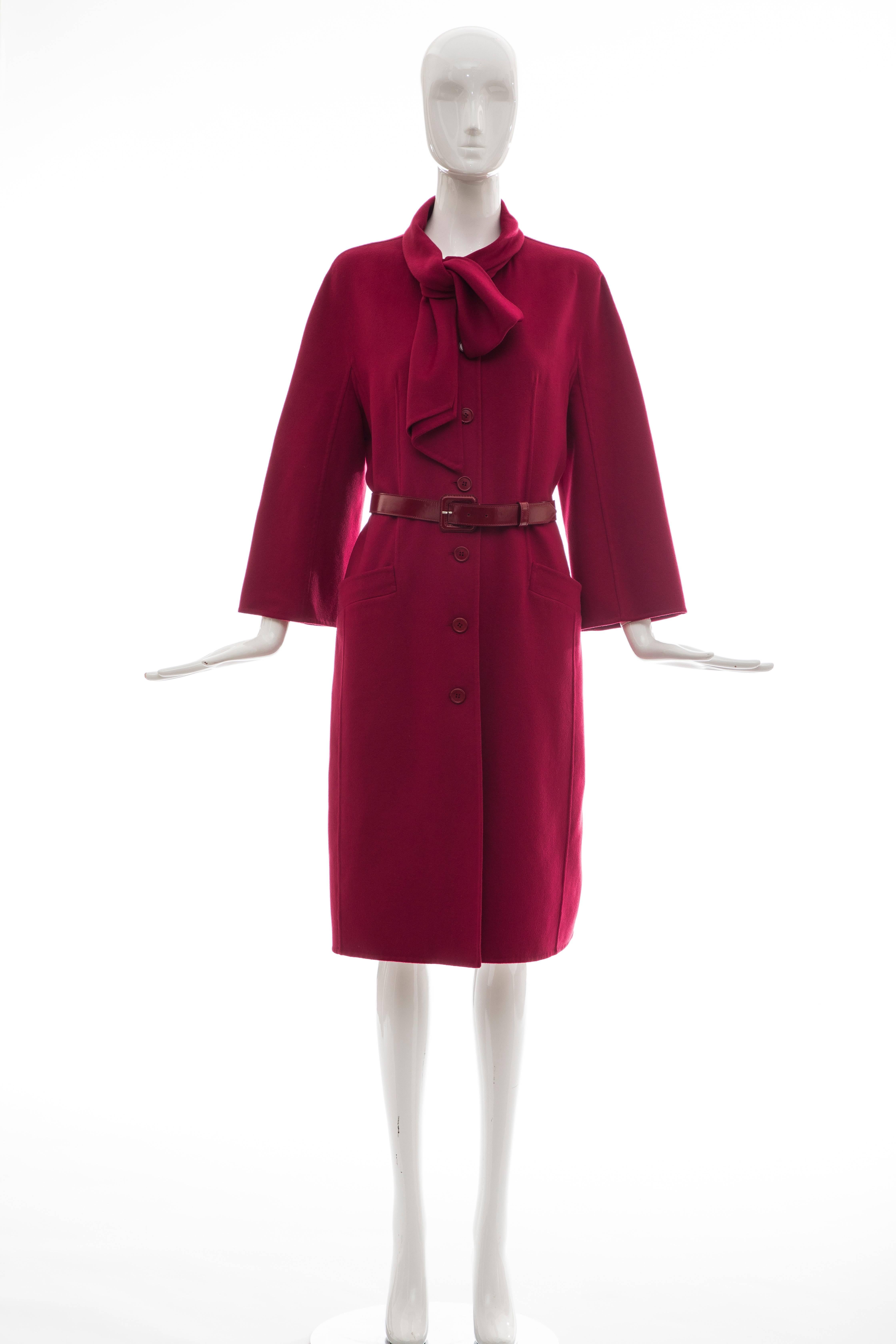 Christian Dior crimson red cashmere long coat with three-quarter sleeves, leather belt at waist, dual slit pockets at front and button closures at front.

FR. 40, US. 8

Bust: 38, Waist 37, Shoulder 18, Length 41.25, Sleeve 27

