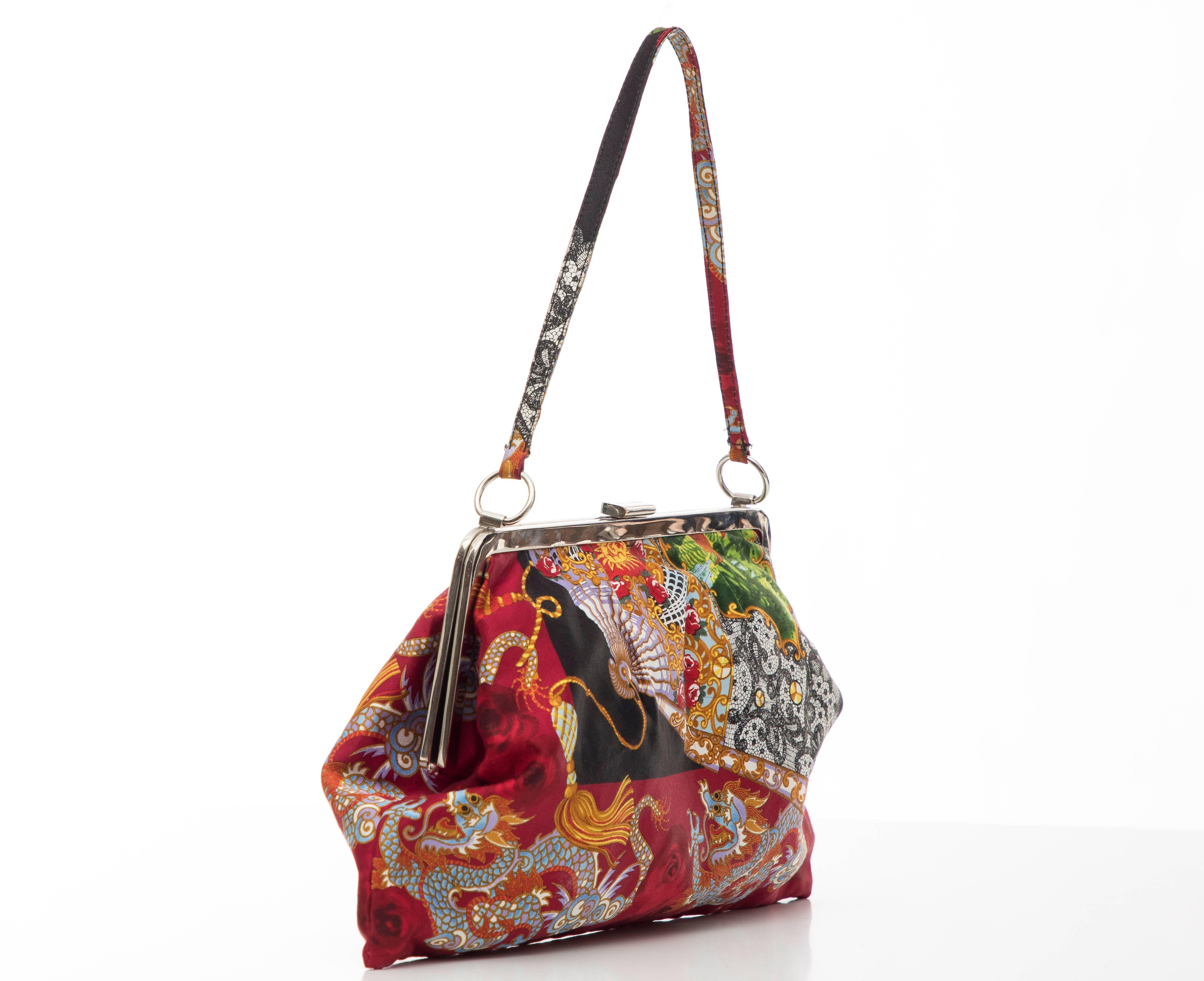 Dolce and Gabbana, Circa 1999 printed fan and dragon silk evening bag with silver-tone hardware, single flat shoulder strap, black satin lining, single slit pocket at interior wall and push-lock closure at top.

Shoulder Strap Drop: 7, Height 7.75,