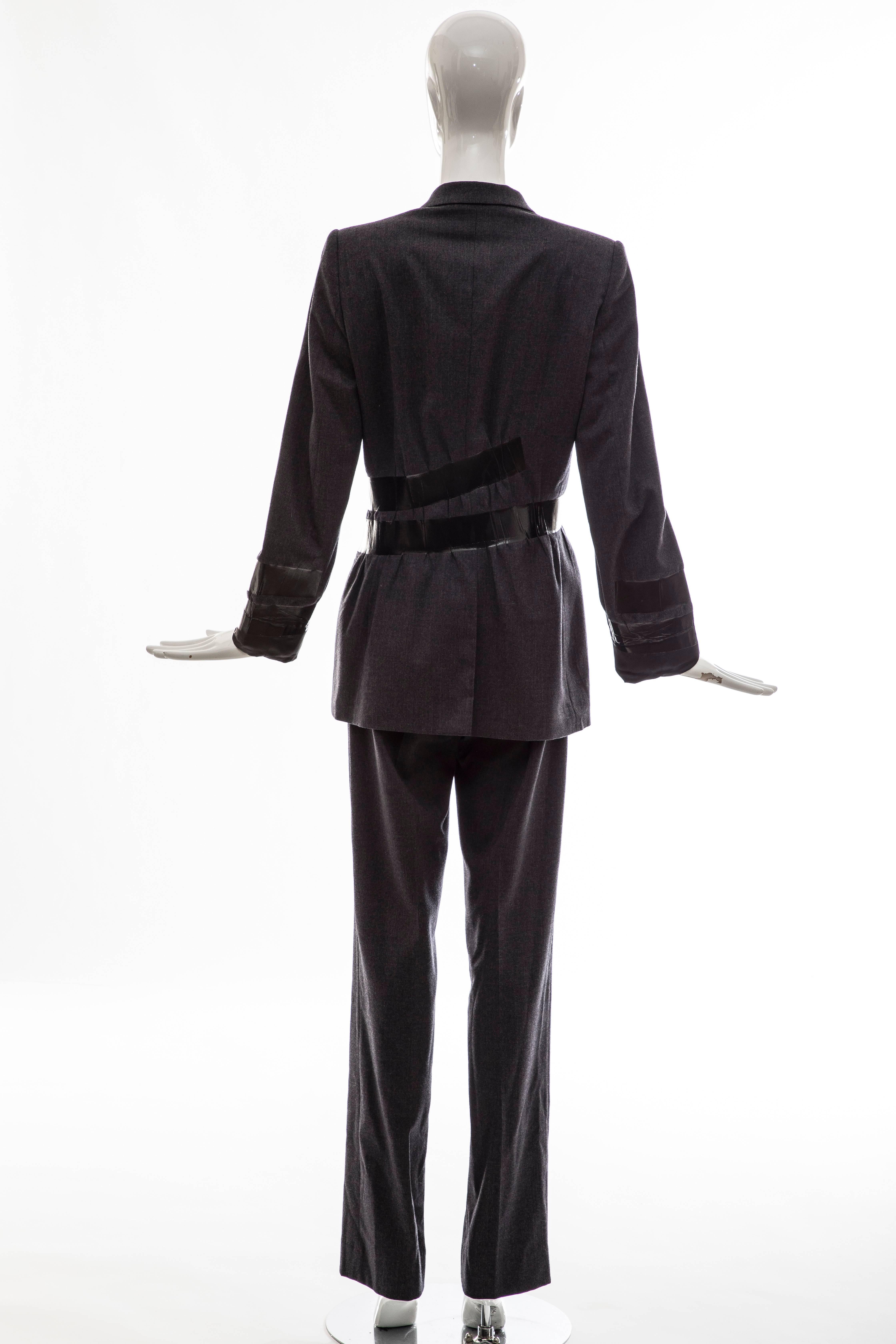 Maison Martin Margiela Artisanal Collection, Autumn-Winter 2009 charcoal grey virgin wool high-rise pantsuit. Blazer features duct tape accents throughout, notched lapels, structured shoulders, long sleeves, three pockets and hook-and-eye closures