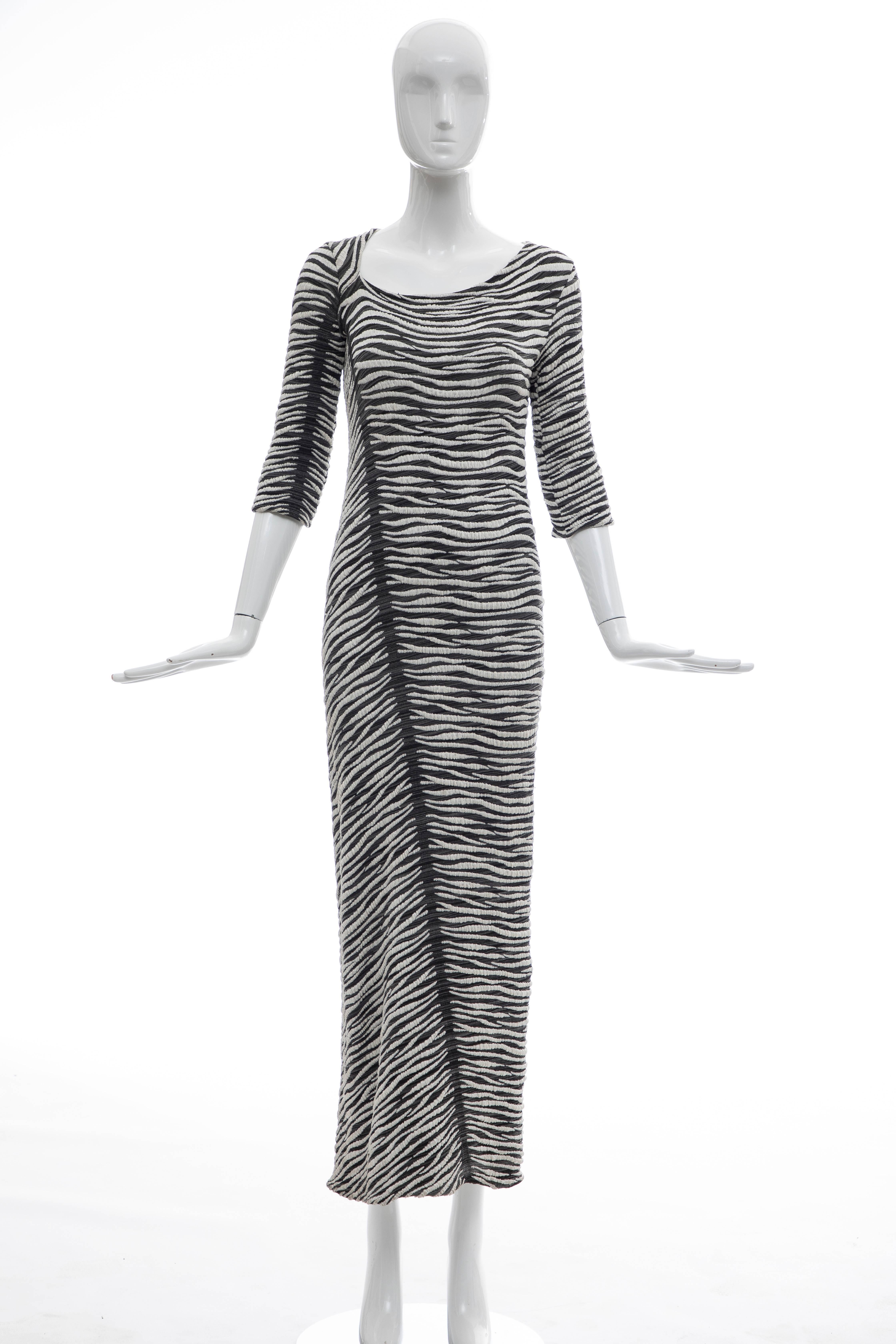 Gianfranco Ferre, circa 1990's long sleeve stretch knit dress.

Bust 36, Waist 32, Hips 38, Length 48