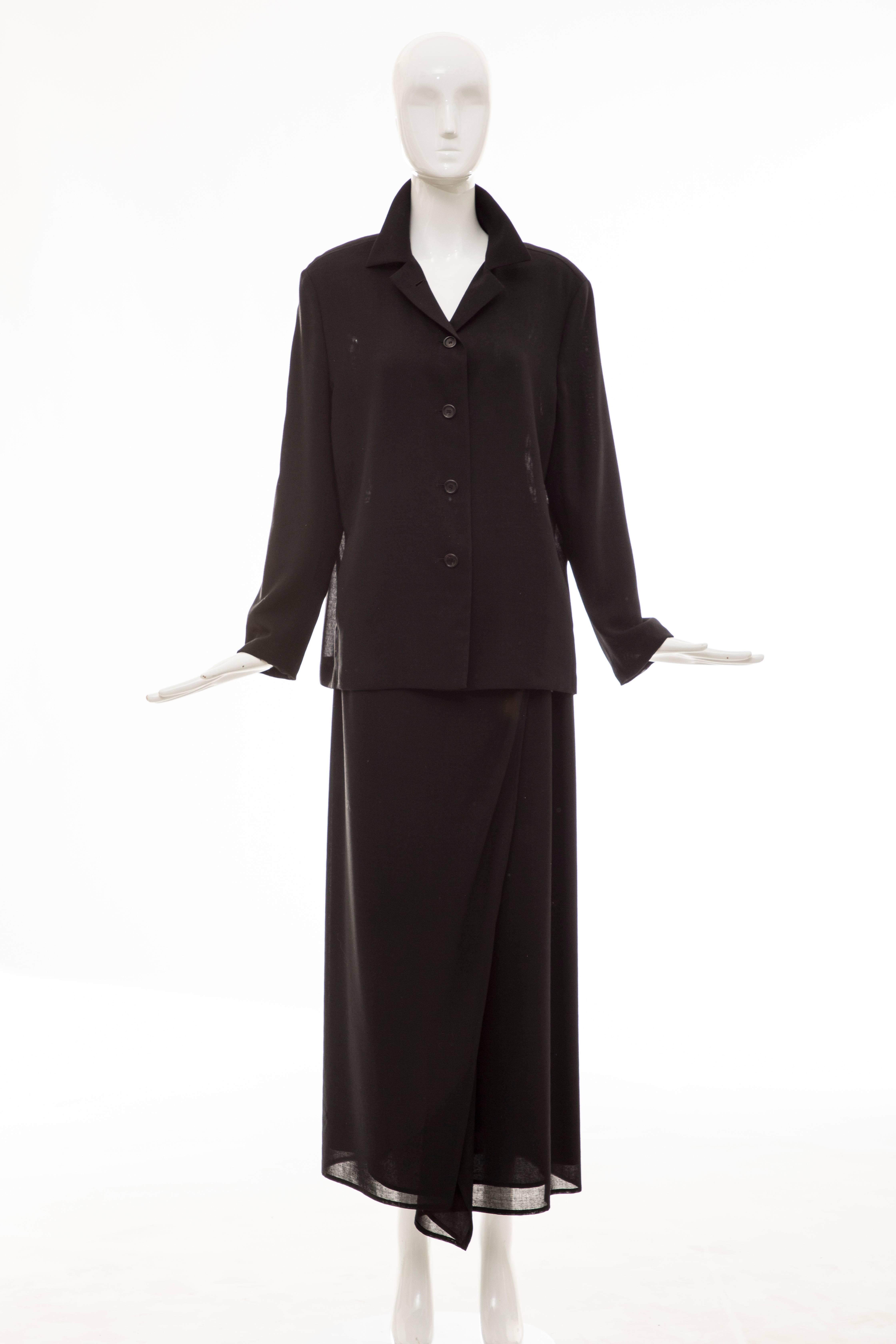 Cerruti 1881, Circa 1990's black lightweight wool gauze skirt-suit. Jacket has button front with two front pockets and skirt has hook-and-eye and snap closure and fully lined in silk.

US. 10

Jacket: Bust 43, Waist 43, Shoulders 17, Hips 44, Length