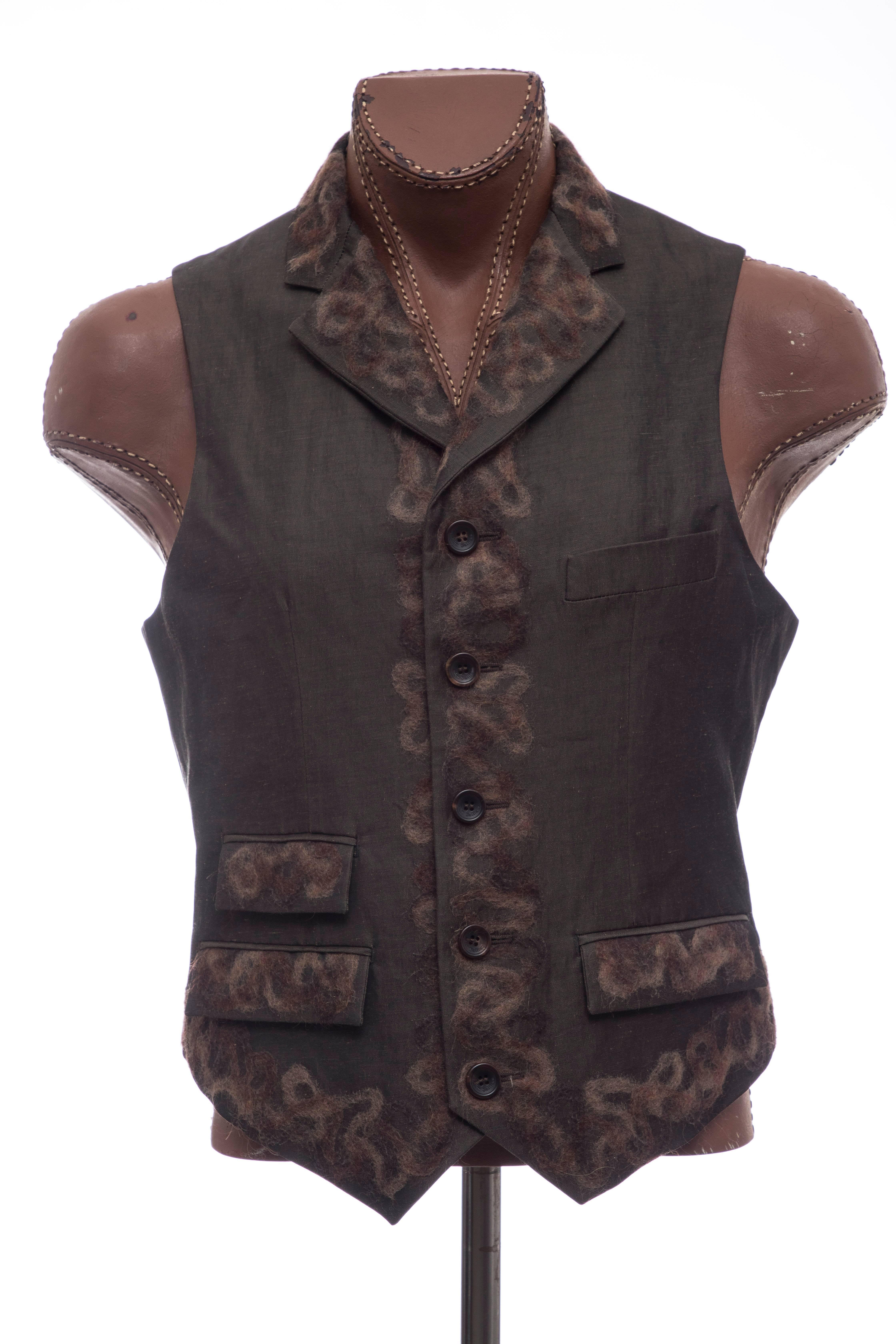 John Galliano, Fall 2008 runway men's linen-blend vest with embroidered mohair trim, notched lapels, three flap pockets and button closures.

IT. 50, US. 40

Chest: 41, Length 21.5
