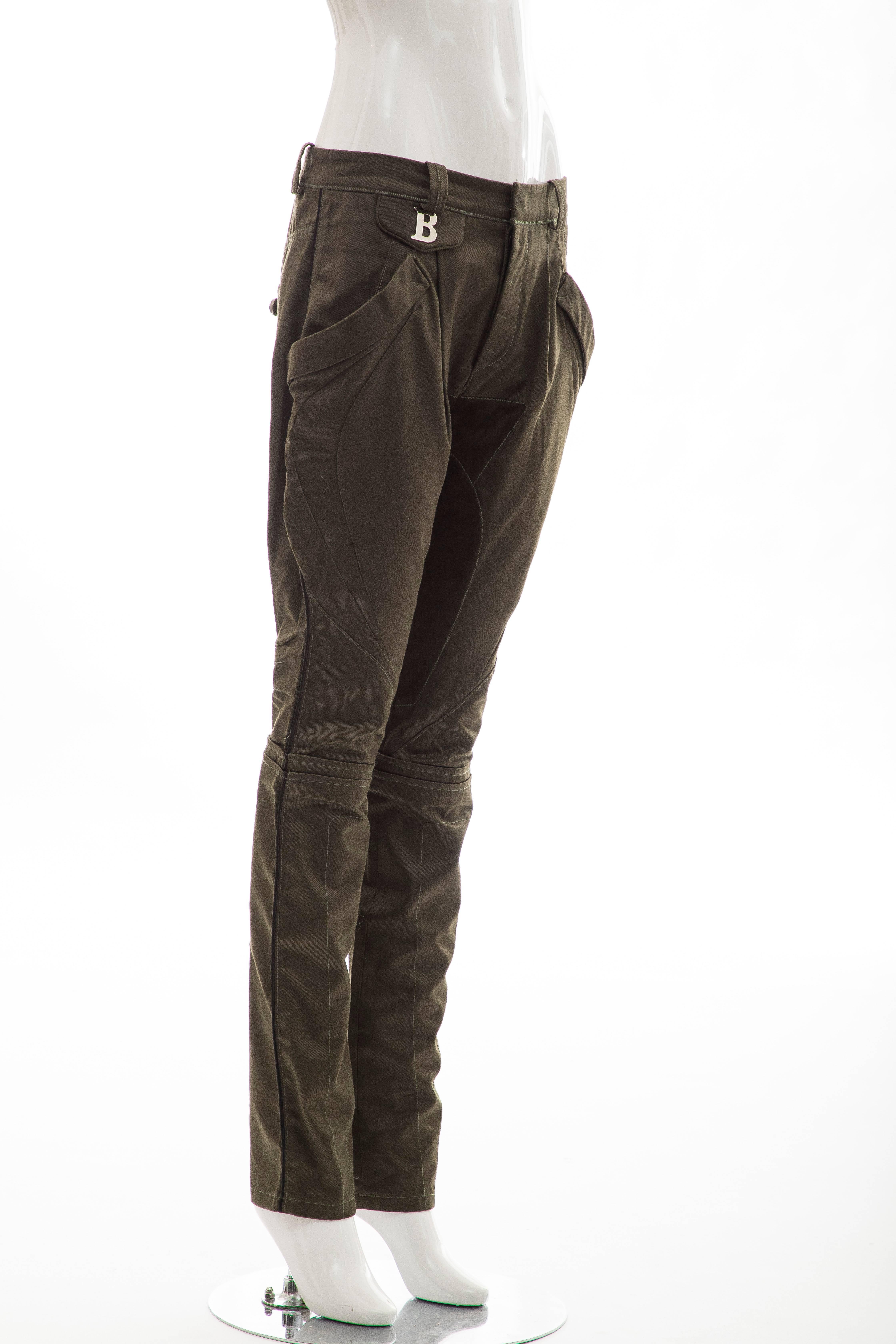 Nicolas Ghesquière For Balenciaga, Fall 2007 cotton olive green pants with suede accents at inseam, four pockets and button closures at front.

FR. 38, US. 6

Waist: 31, Hip: 38, Rise: 10.5, Inseam: 31.5, Leg Opening: 12
