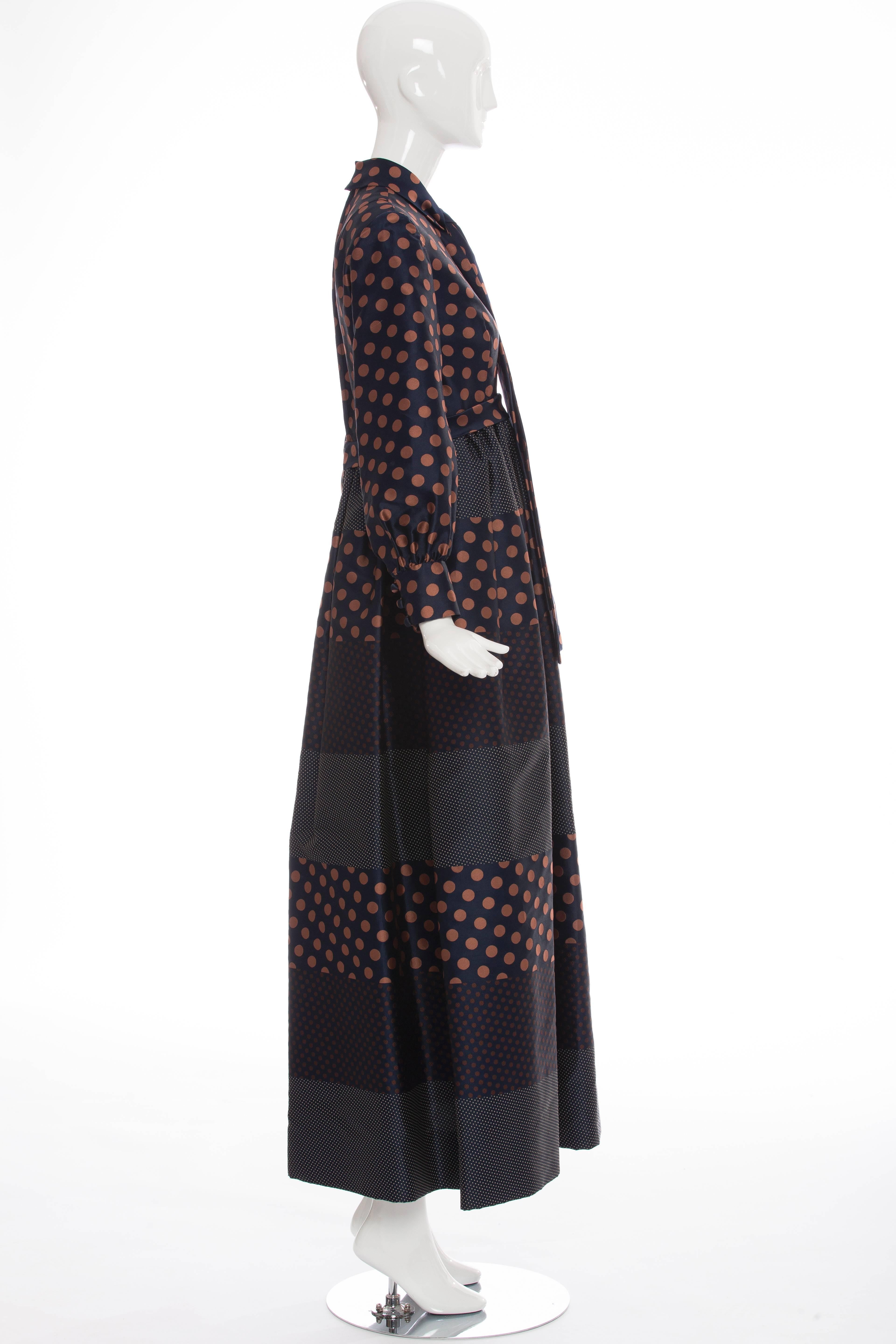 Geoffrey Beene Boutique, Circa 1970's, navy blue polkadot, silk long sleeve dress, two front pockets,  back zip and fully lined.