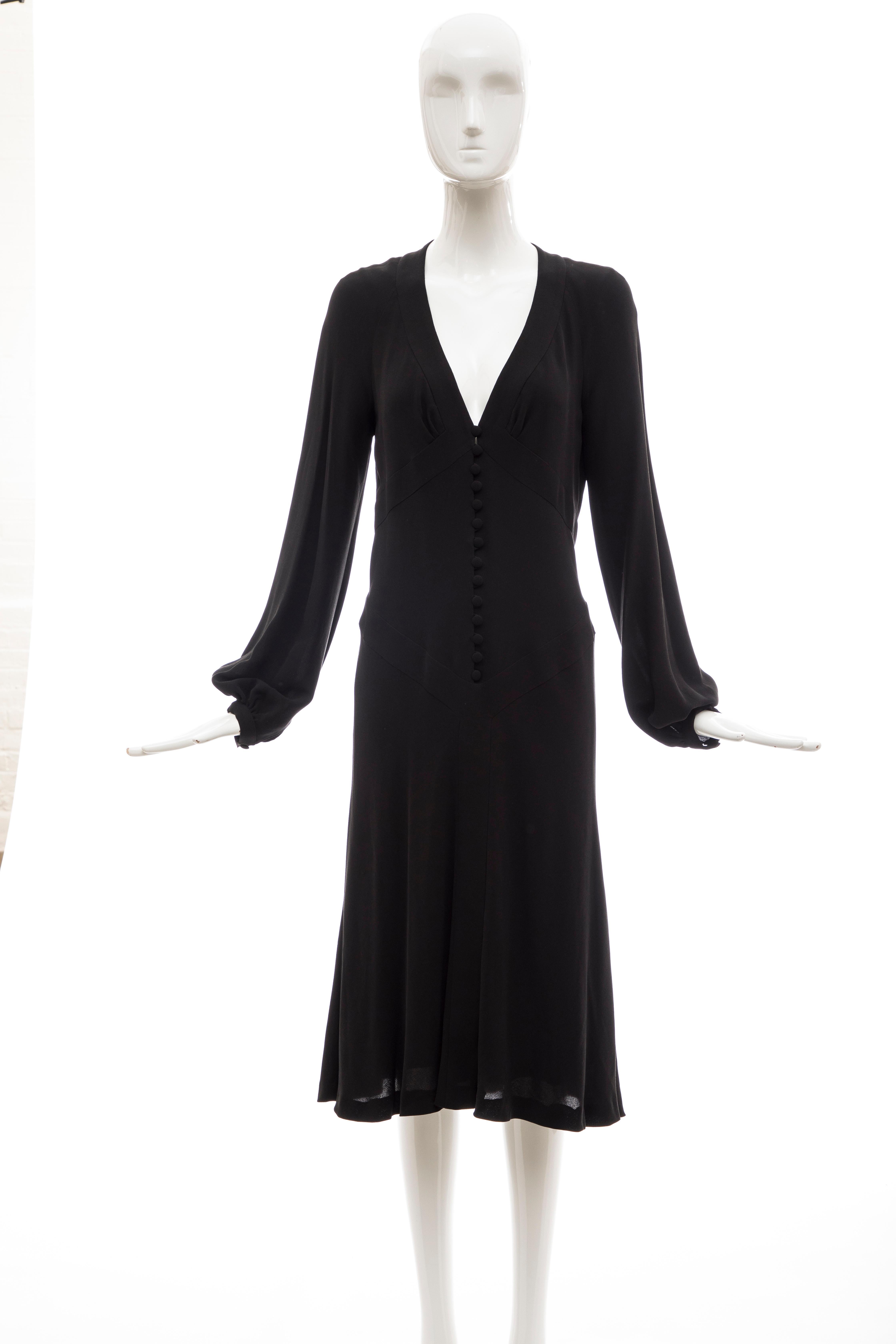 Alexander McQueen, Spring 2007 black silk long sleeve covered button front dress, fully lined in silk.

Retail: 2380

IT. 42
US. 6

Bust: 32, Waist 30, Hip: 35, Length: 43.5, 