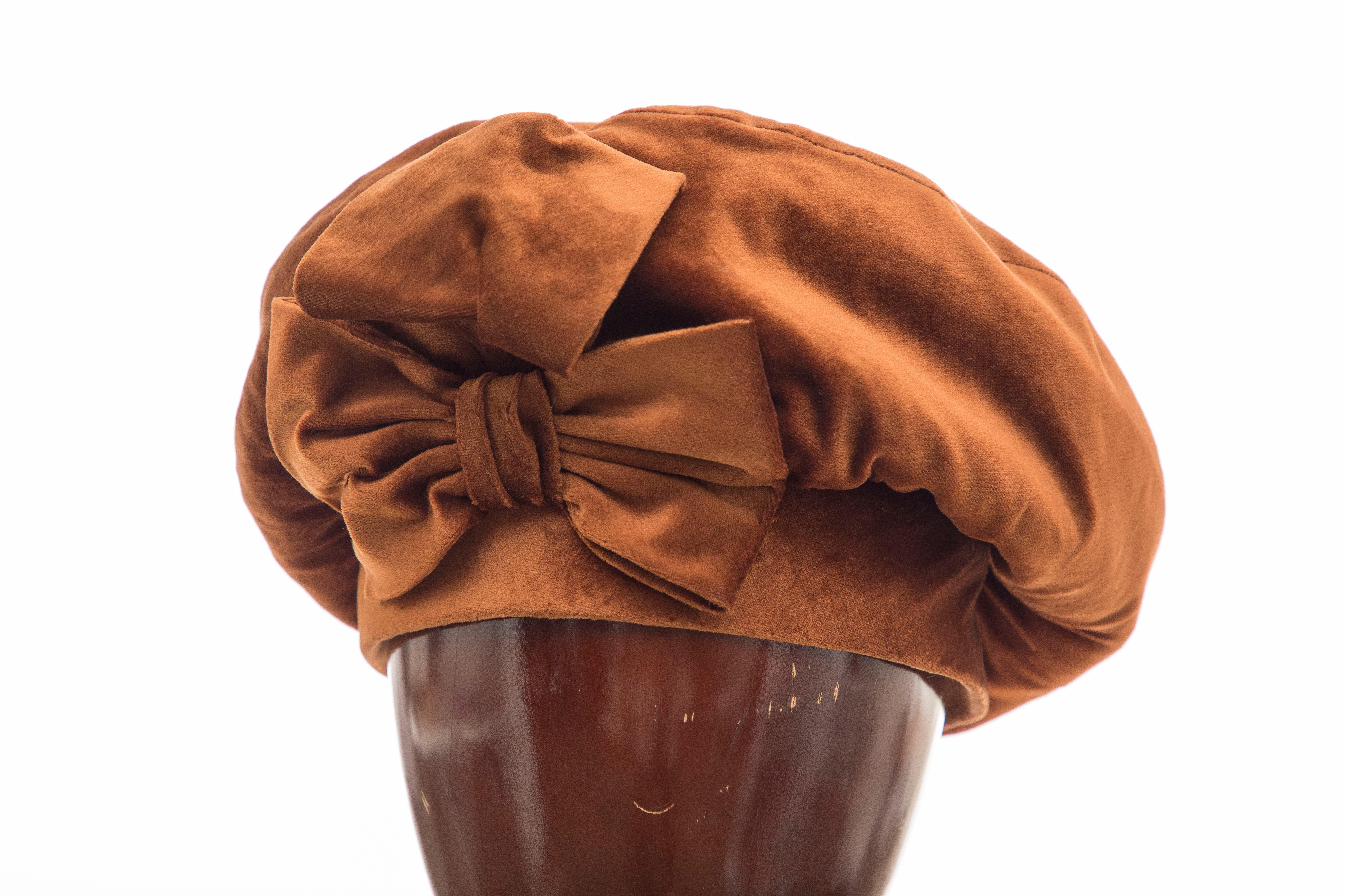Mr. John, Circa: 1950's cinnamon silk velvet hat with bow.

Circumference: 19.5

