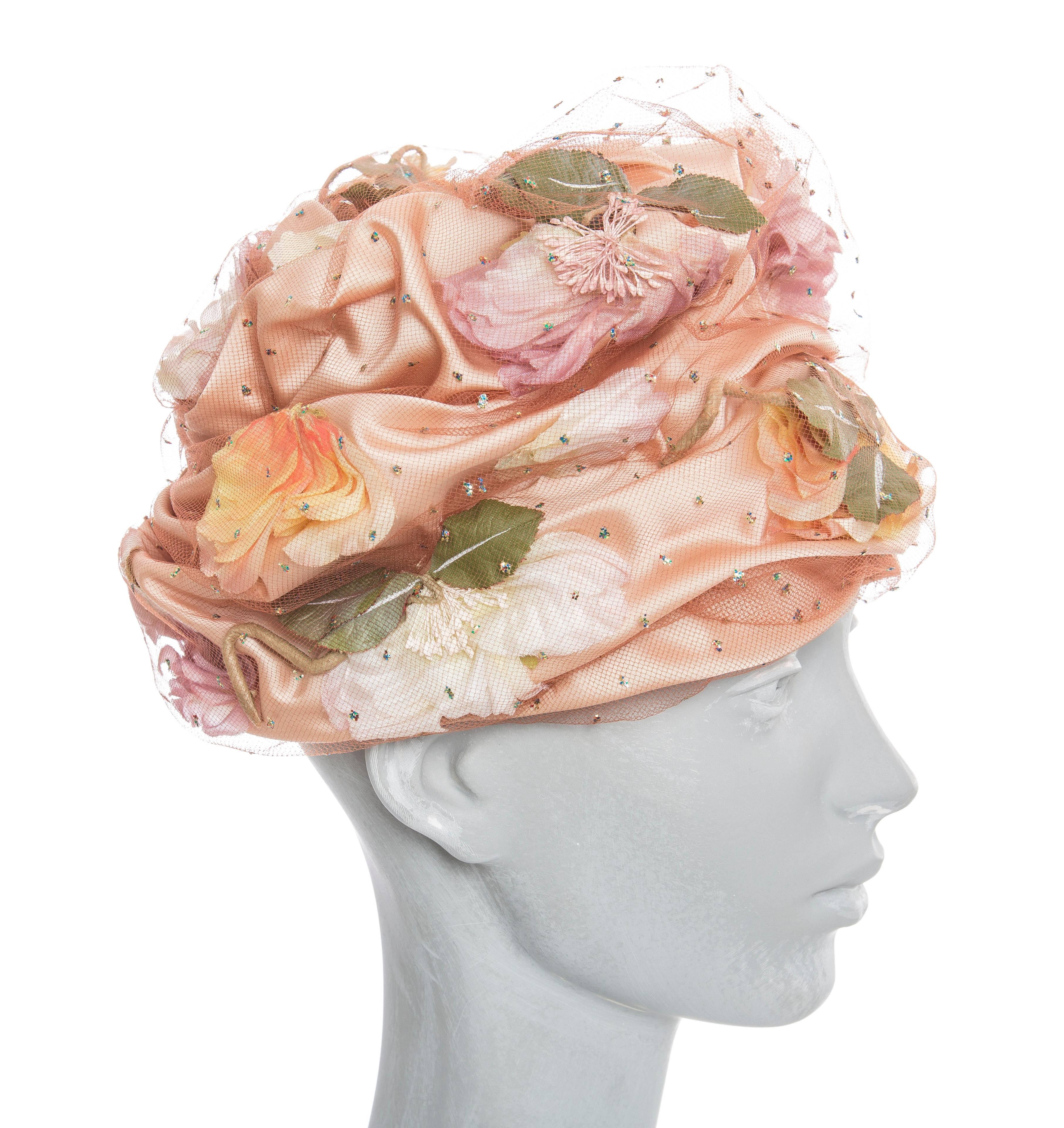 Christian Dior Chapeaux peach hat with flowers covered with netting.<br />
<br />
circumference 24 inch