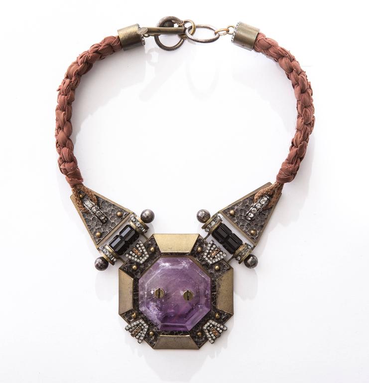 Lanvin by Alber Elbaz chiffon braided necklace with Swarovski crystal accents, amethyst at center and toggle lock closure. Includes original box.

Chain Length 16”, Ornament Width 3”, Ornament Length 3”