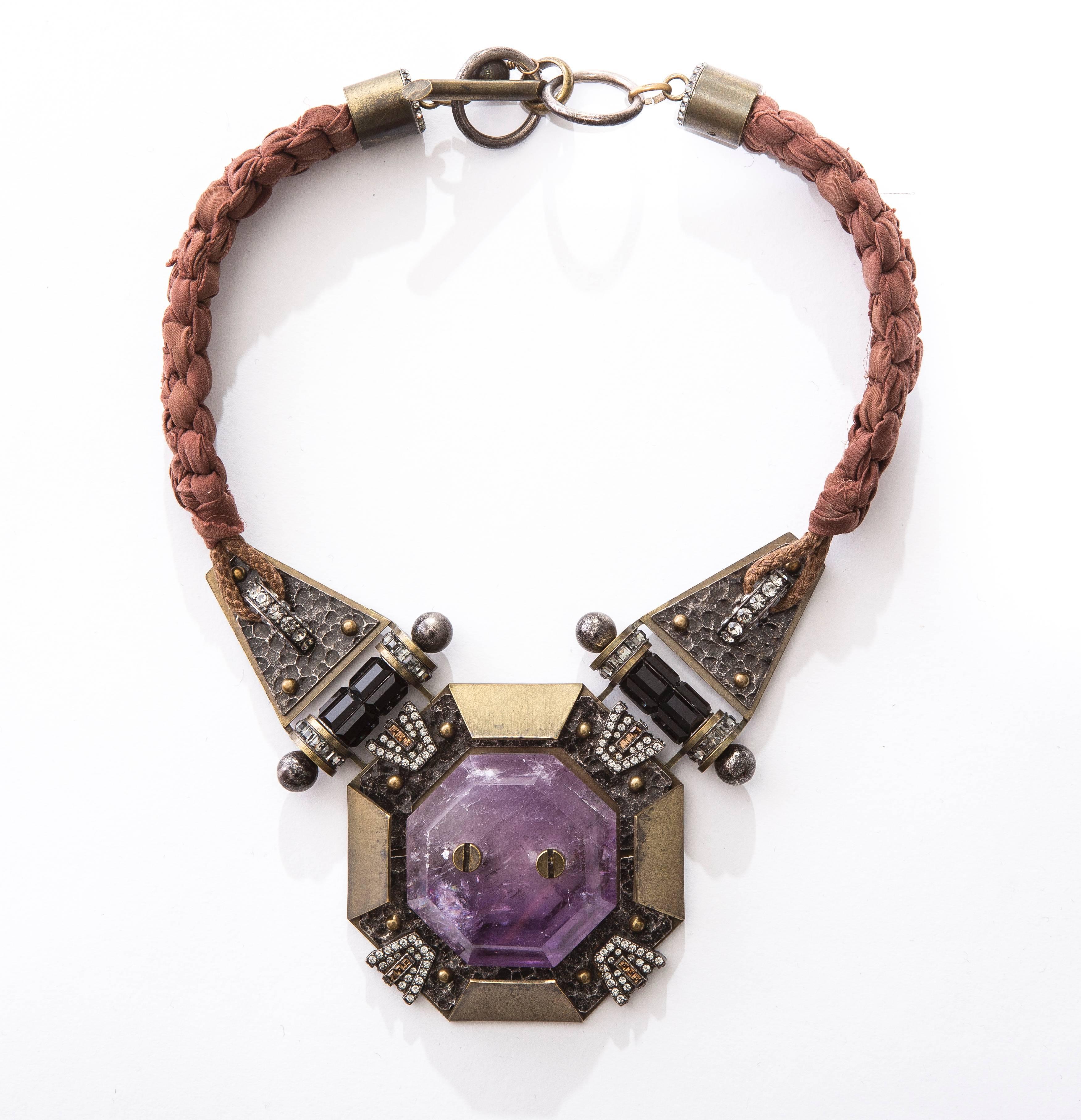 Lanvin by Alber Elbaz chiffon braided necklace with Swarovski crystal accents, amethyst at center and toggle lock closure. Includes original box.

Chain Length 16”, Ornament Width 3”, Ornament Length 3”