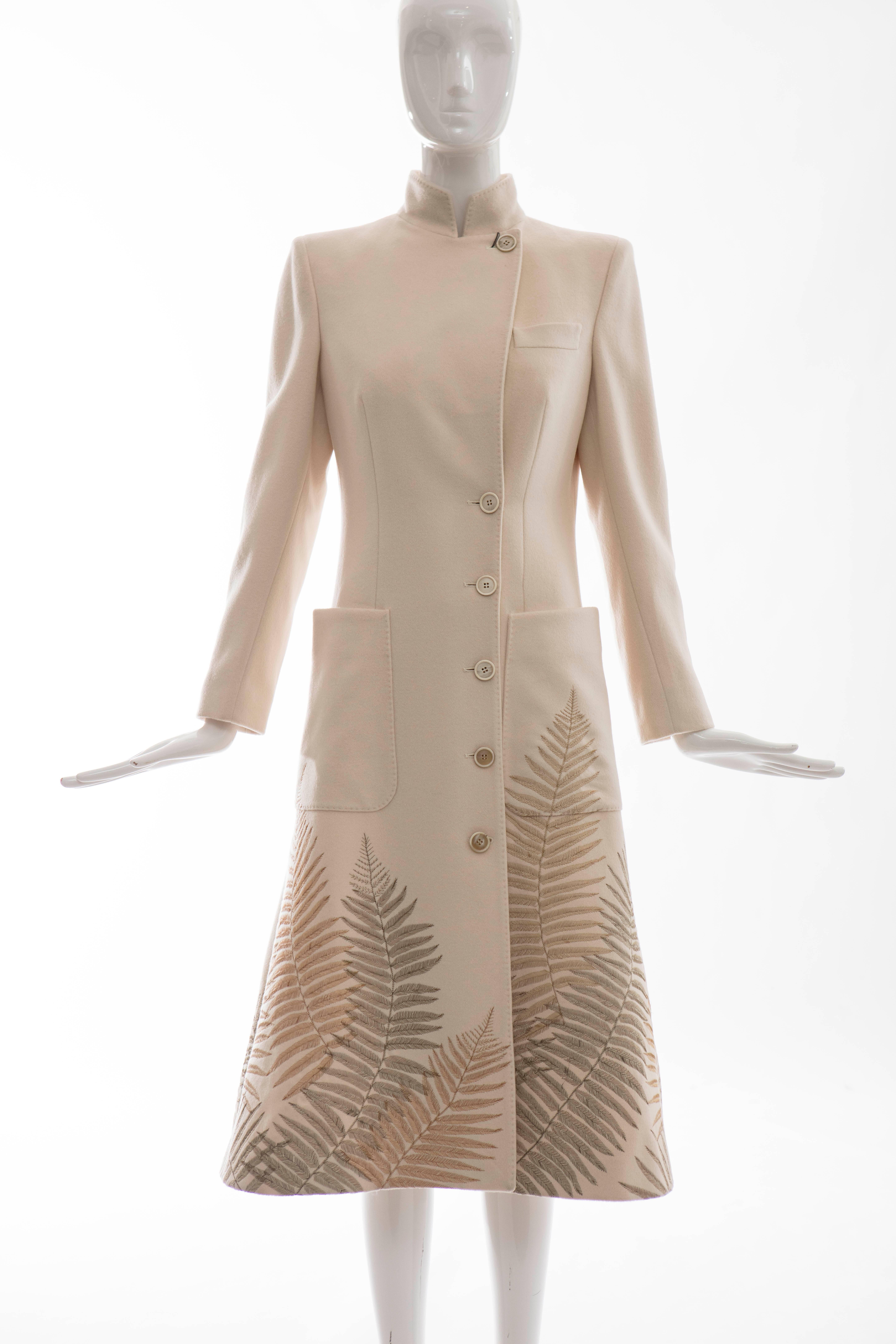 Alexander McQueen, Autumn-Winter 2007 cream cashmere coat with gold-tone fern embroidery, large patch pockets at waist, front button closures and fully lined.

Retail $5325

Bust 36”, Waist 32”, Shoulder 15”, Length 45”

EU.42
US.6