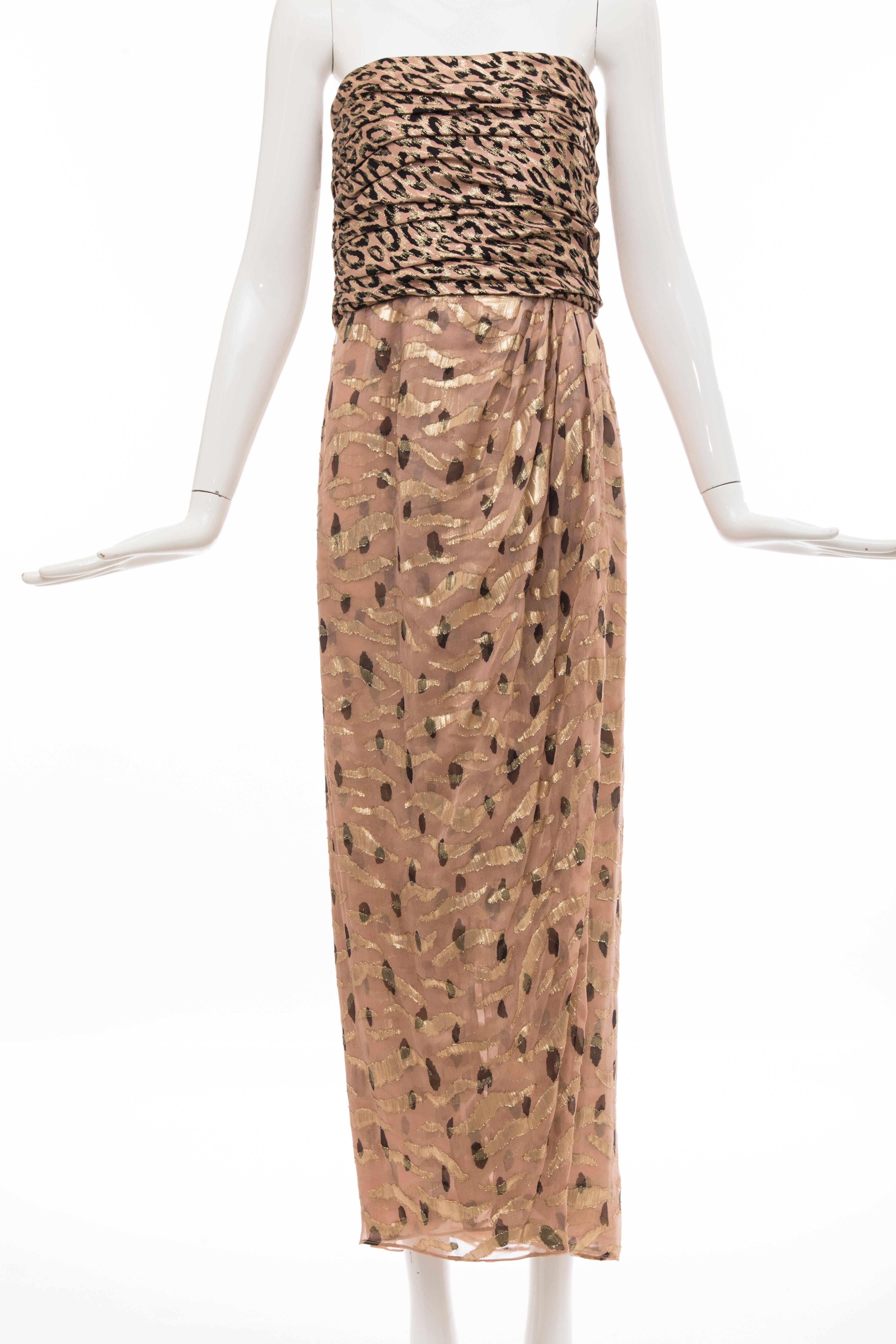 Bill Blass, Autumn-Winter 1989 strapless, lame and chiffon evening dress, shirred leopard print lame bodice, printed chiffon and lame print tulip shaped skirt, back zip and fully lined in silk chiffon.

Sized marked a US 12 but fits like a modern 10