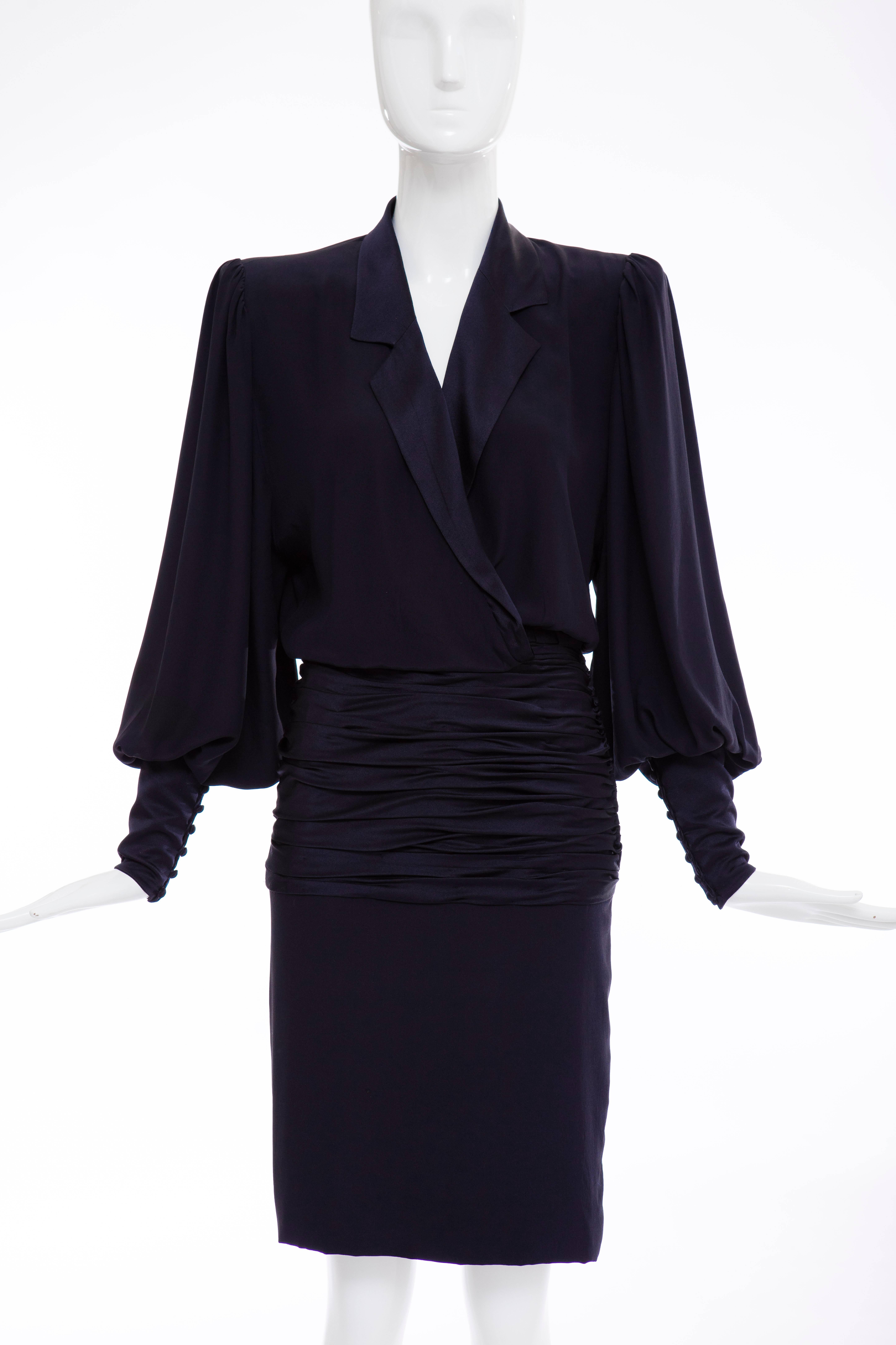 Jean - Louis Scherrer numbered Haute Couture, circa 1980's navy blue, silk crepe and silk satin dress, shawl collar, bishop sleeves, shoulder pads, shirred satin waist, concealed front snaps and fully lined in silk satin.
