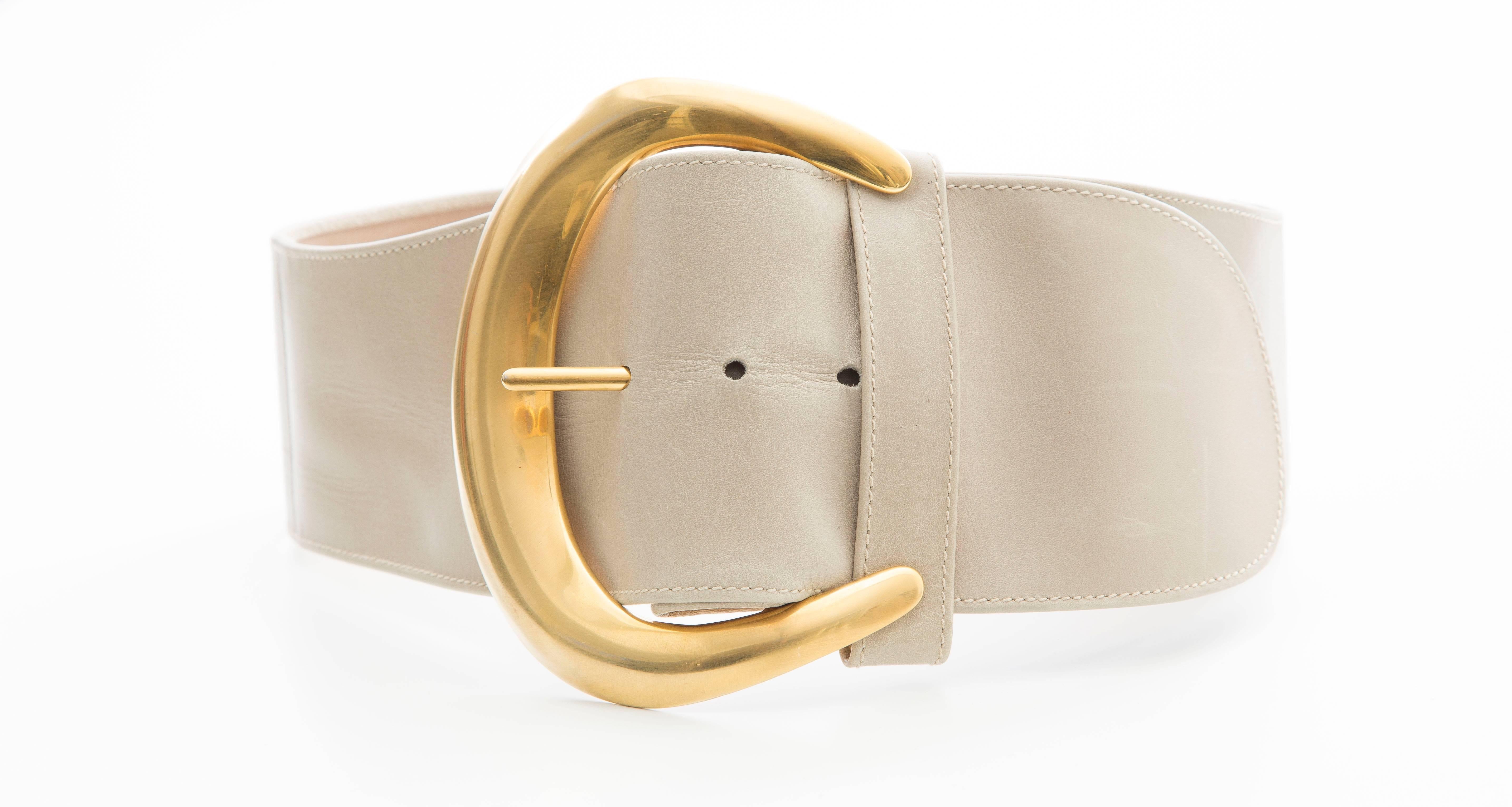 Donna Karan, circa 1980's, leather belt with gold tone buckle designed by Robert Lee Morris
