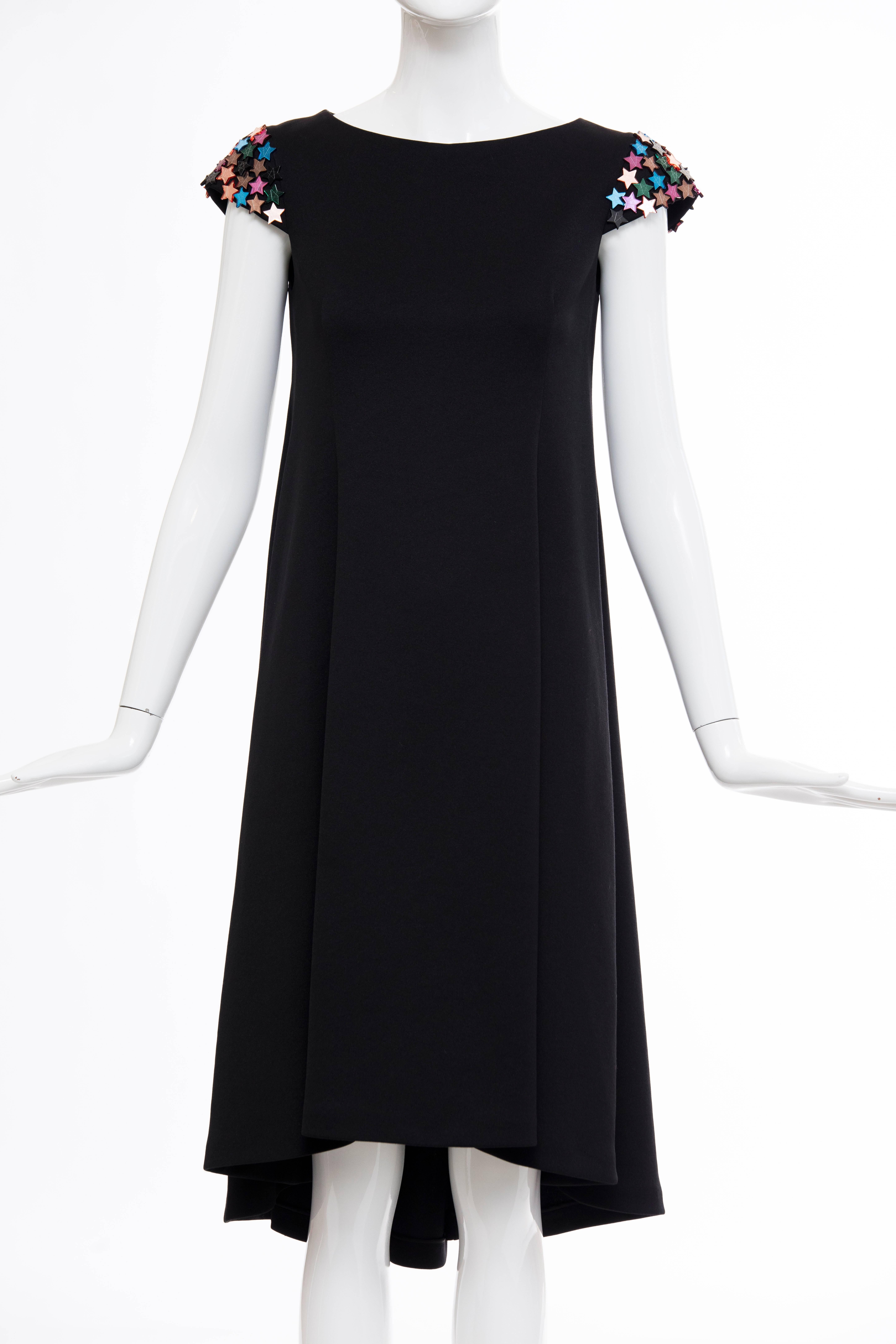 Yves Saint Laurent blackA-line dress with bateau neckline, seam detailing throughout, multicolor star adornments at sleeves and zip closure at center back.