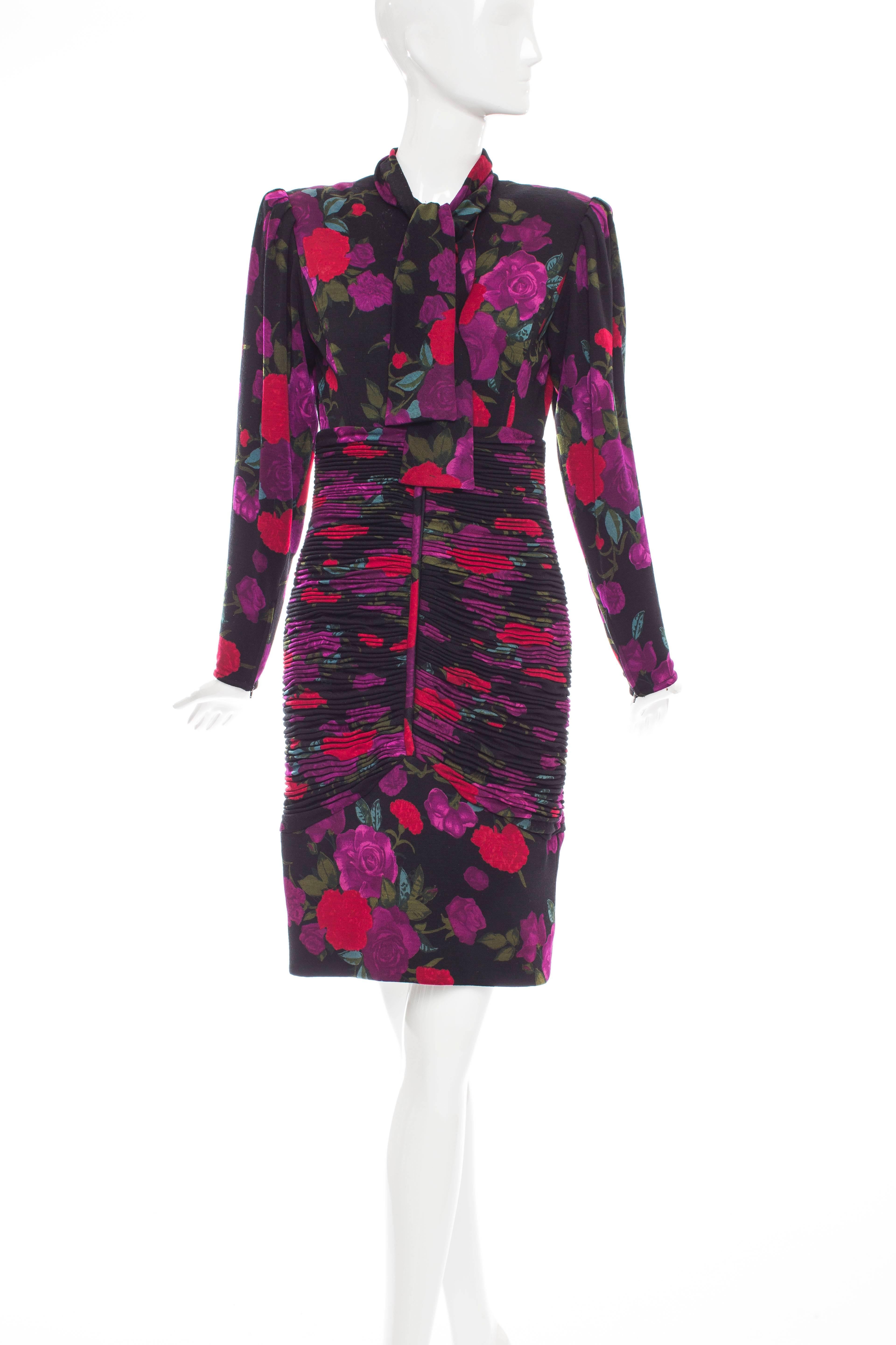 Emanuel Ungaro, circa 1980's floral wool jersey long sleeve dress,ruched midriff,black faceted glass buttons,zippered sleeves,shoulder pads and lined from waist on down.  

US. 4

Bust 33, Waist 26, Hip 32, Length 39
