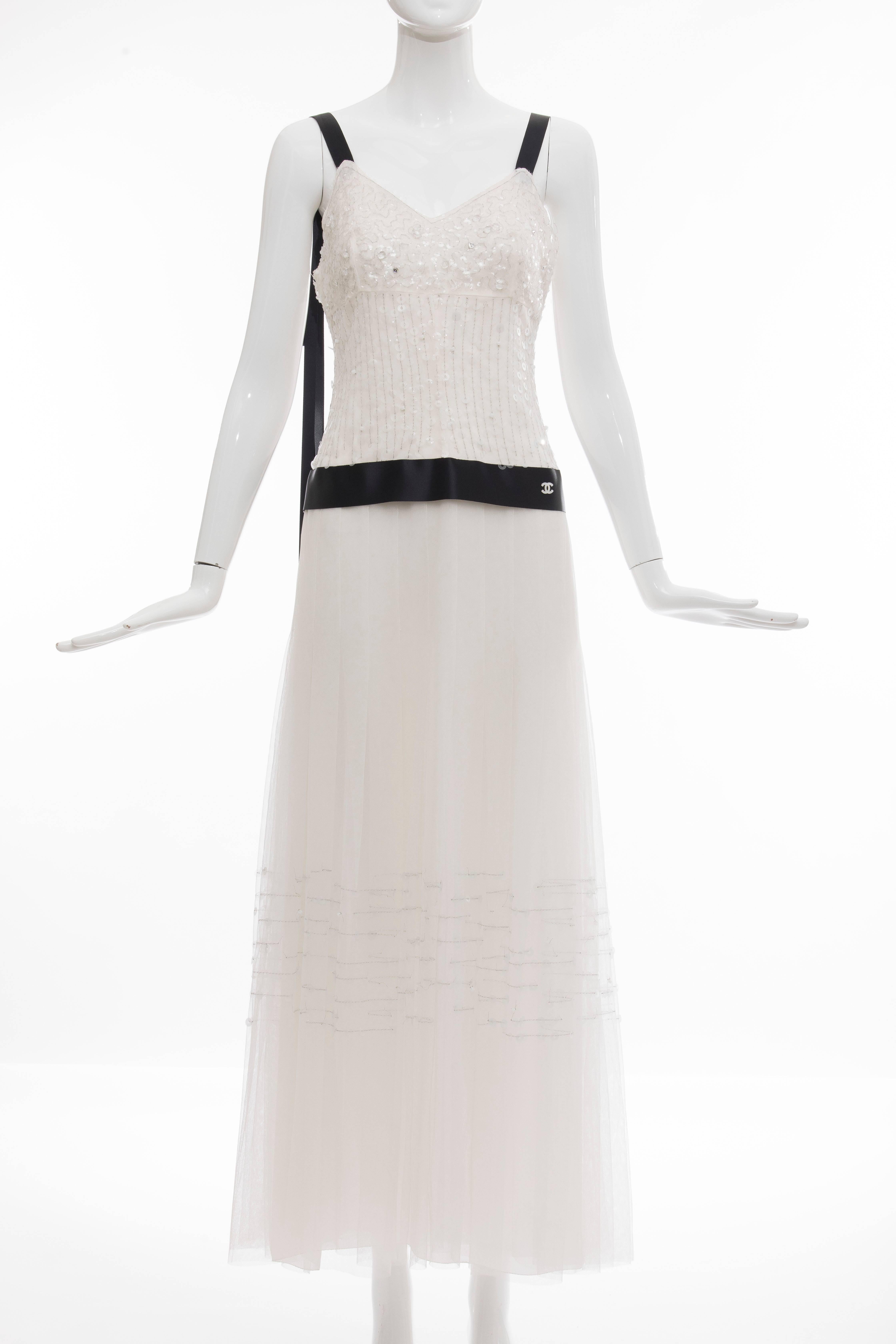 Chanel, Cruise 2005, white mesh evening dress with embellished white sequins and beaded, sweetheart neck, empire waist, detachable mesh shawl,detachable feather Camellia pin at bust, satin trim, box pleating at skirt and back pearl button closures.