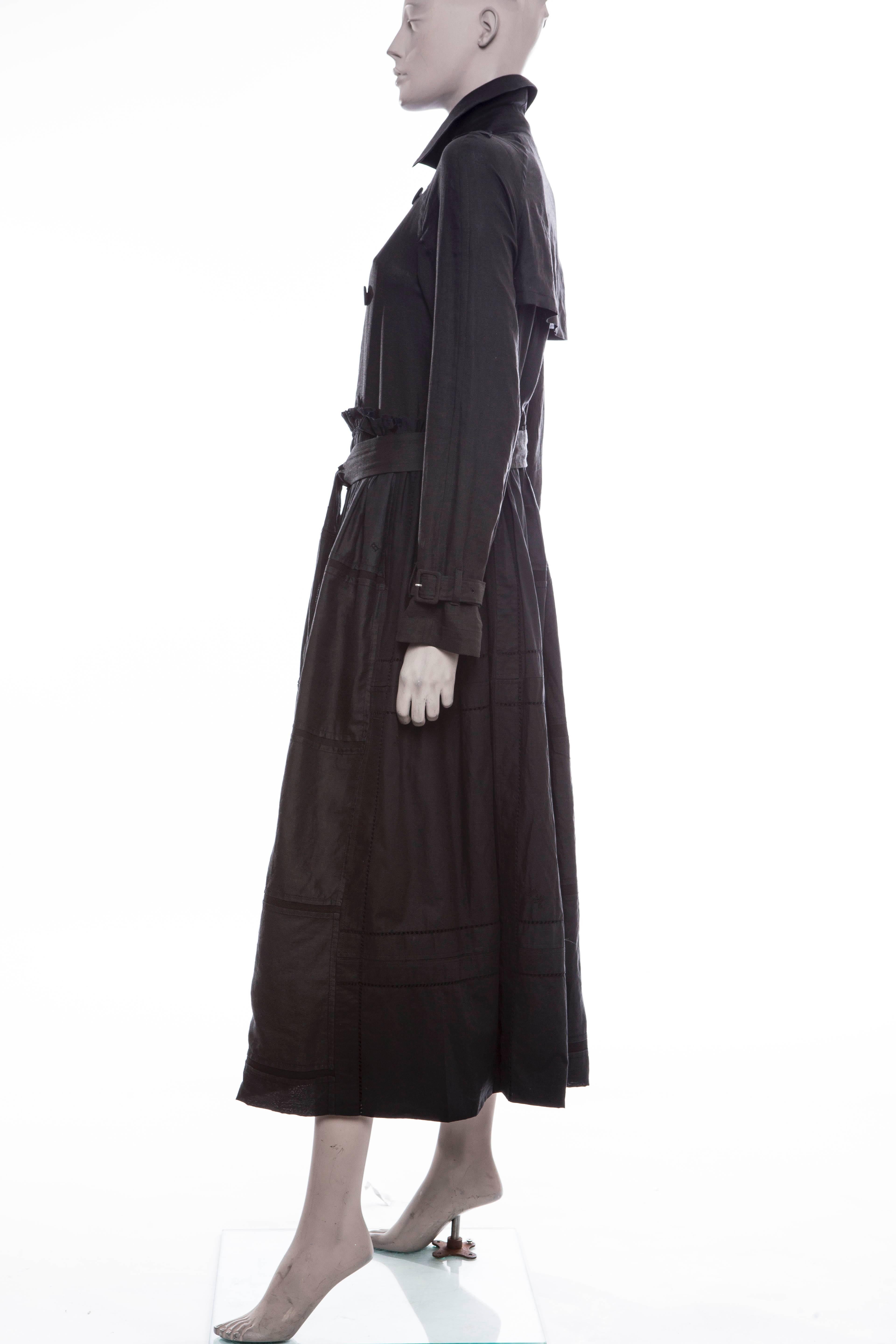 Tao Comme Des Garcons, circa: 2005,  double breasted, button front trench coat with bamboo bodice and cotton full skirt, two front pockets, self belt and fully lined.