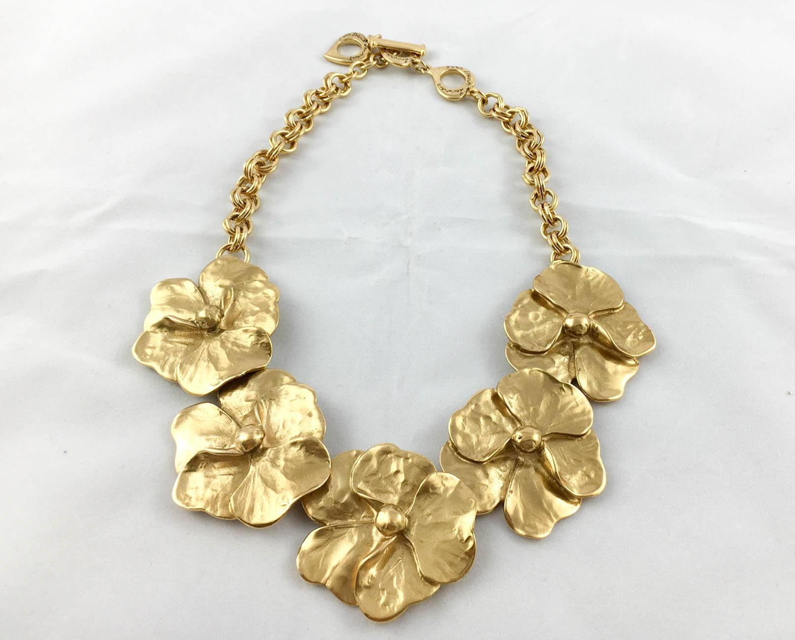 Rare Vintage Yves Saint Laurent Gold-Plated Set. Beautiful Yves Saint Laurent set by Robert Goossens comprising of a necklace, a pair of clip-on earrings and a pendant/brooch. The floral motif is gorgeous and a perfect example of the long and