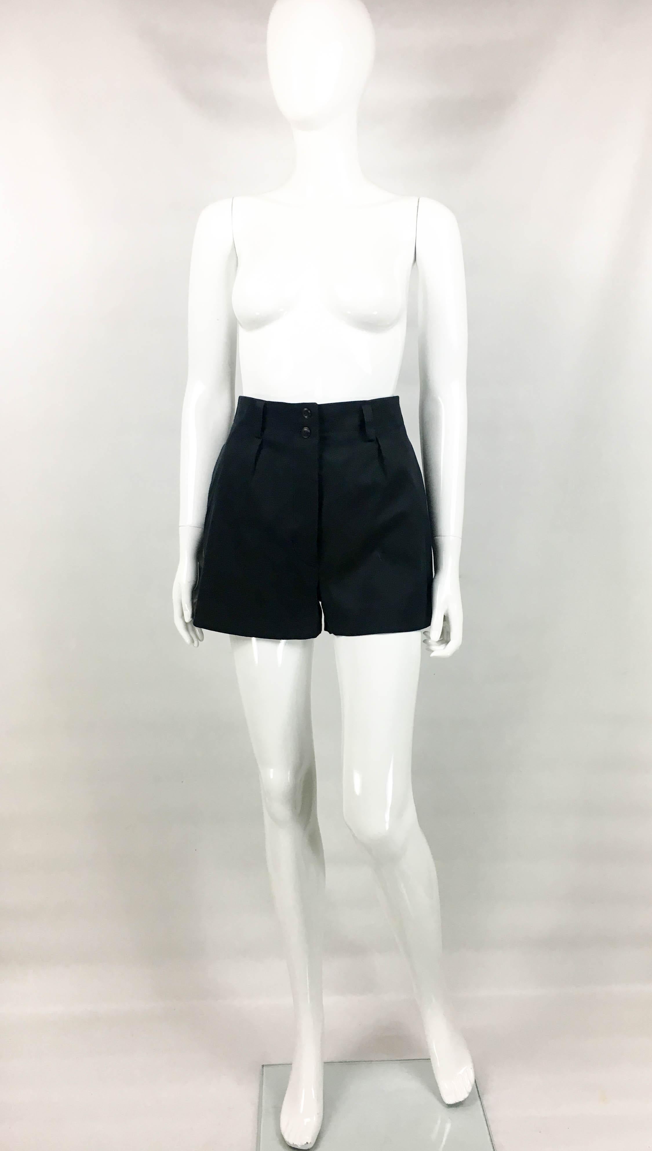 Vintage Alaia Black Cotton Shorts. These very cute shorts by Azzedine Alaia date back from the 1990’s. Made in cotton blend, these tailored shorts have a high waist, side pockets and one pocket on the back. The fit is loose, and the silhouette is