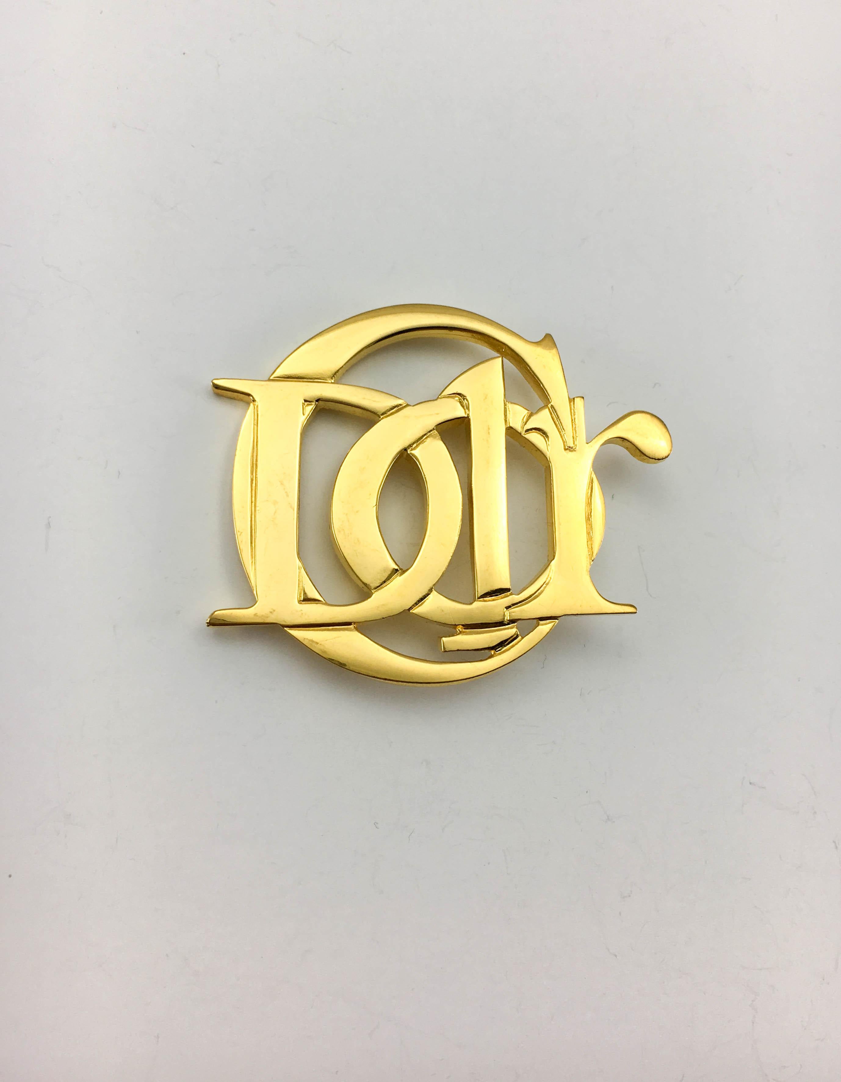 Vintage Dior Gilt Brooch. This piece by Christian Dior dates back from the 1990’s. Made in gilt metal, it shows a stylised ‘C. Dior’ design. Signed on the back. An iconic piece for a fashion statement. 

Label / Designer: Christian Dior

Period: