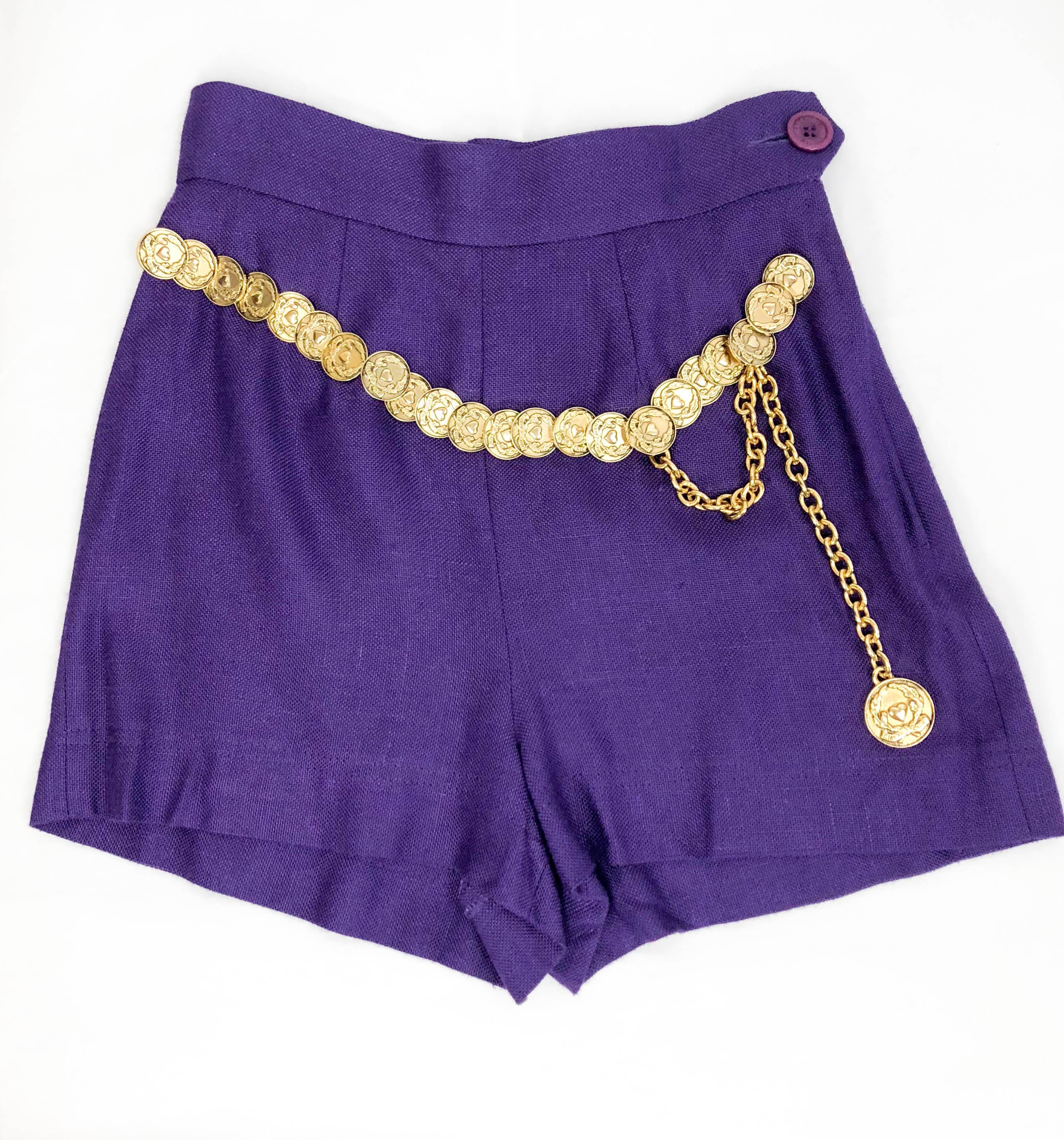 Vintage Moschino Purple Linen Shorts. These really cool shorts by Moschino Cheap and Chic date back from the 1990’s. Made in royal purple linen, they feature an attached belt made of gilt metal coins. Perfect for the sexy and confident girl.

Label