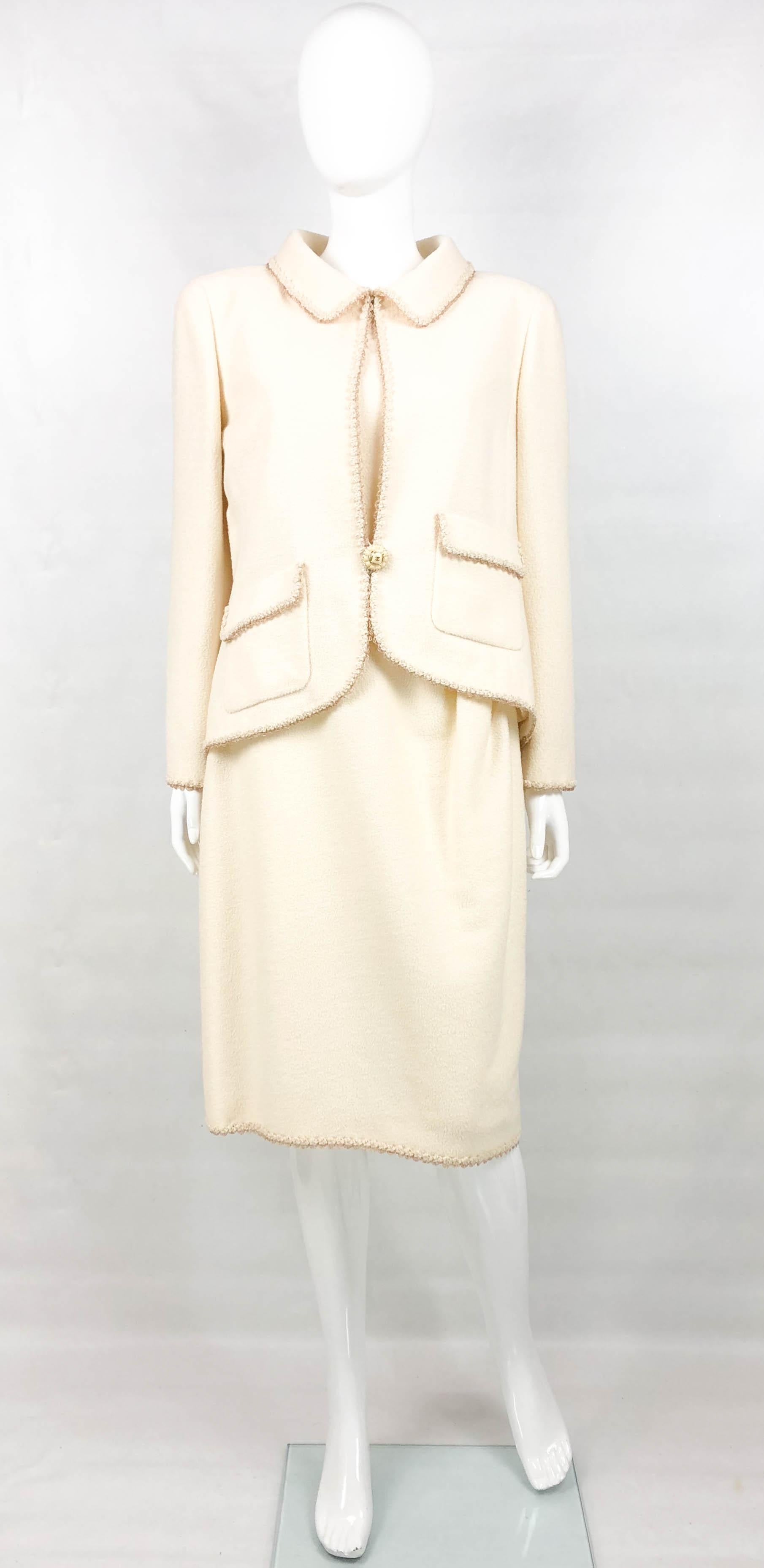 Chanel Runway Look Cream Wool Blend Jacket and Dress Ensemble. This beautiful cream ensemble by Chanel was created for the 2010 Cruise Collection. A model can be seen wearing an identical look on the runway (please refer to photos). The jacket