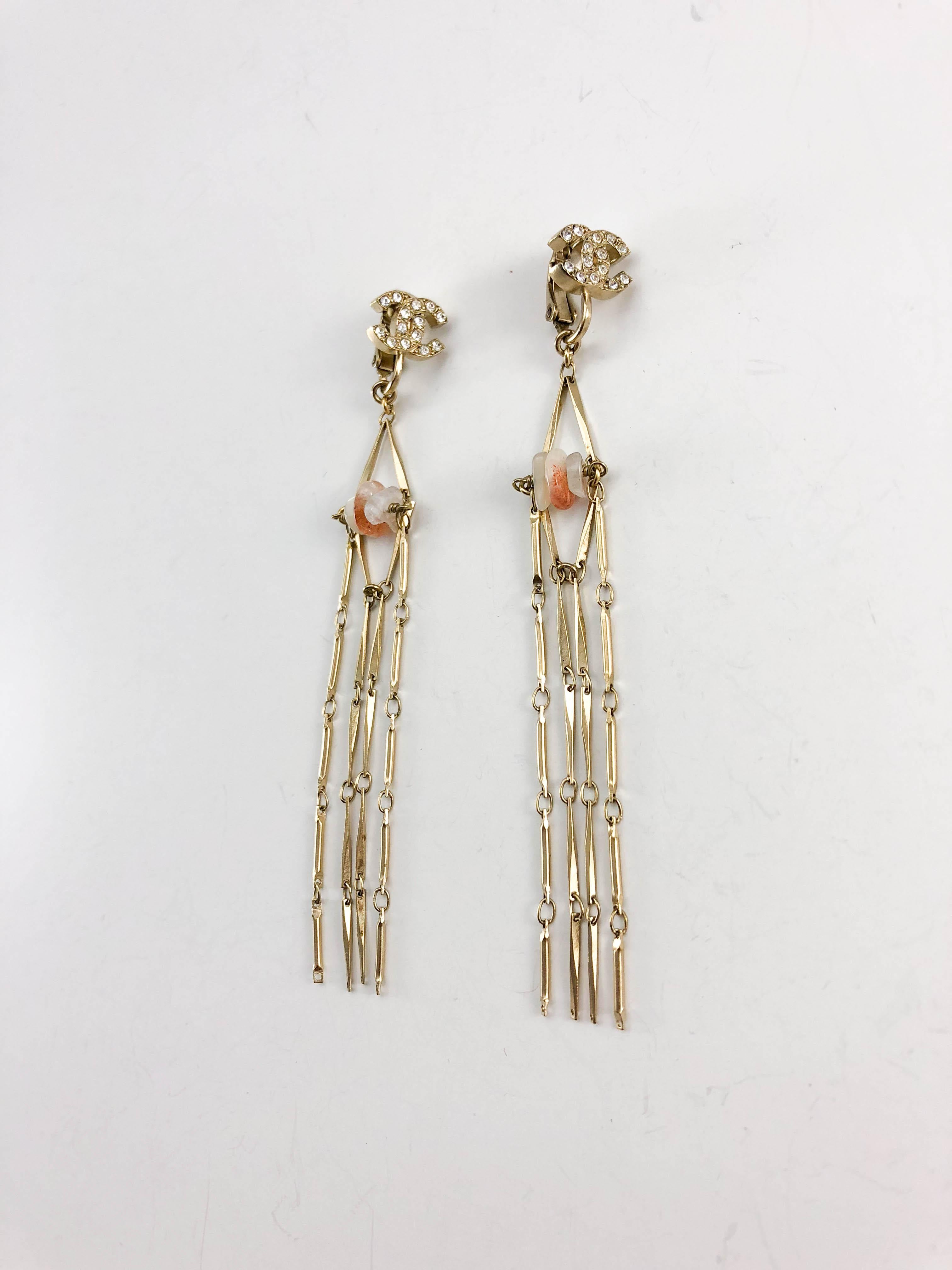 Chanel Long Gilt Dangling Earrings with Agate. These stylish earrings by Chanel earrings were crafted for the 2011 Cruise Collection. The collection was presented in Saint Tropez, and the easy-going sophistication of the French Riviera was all over