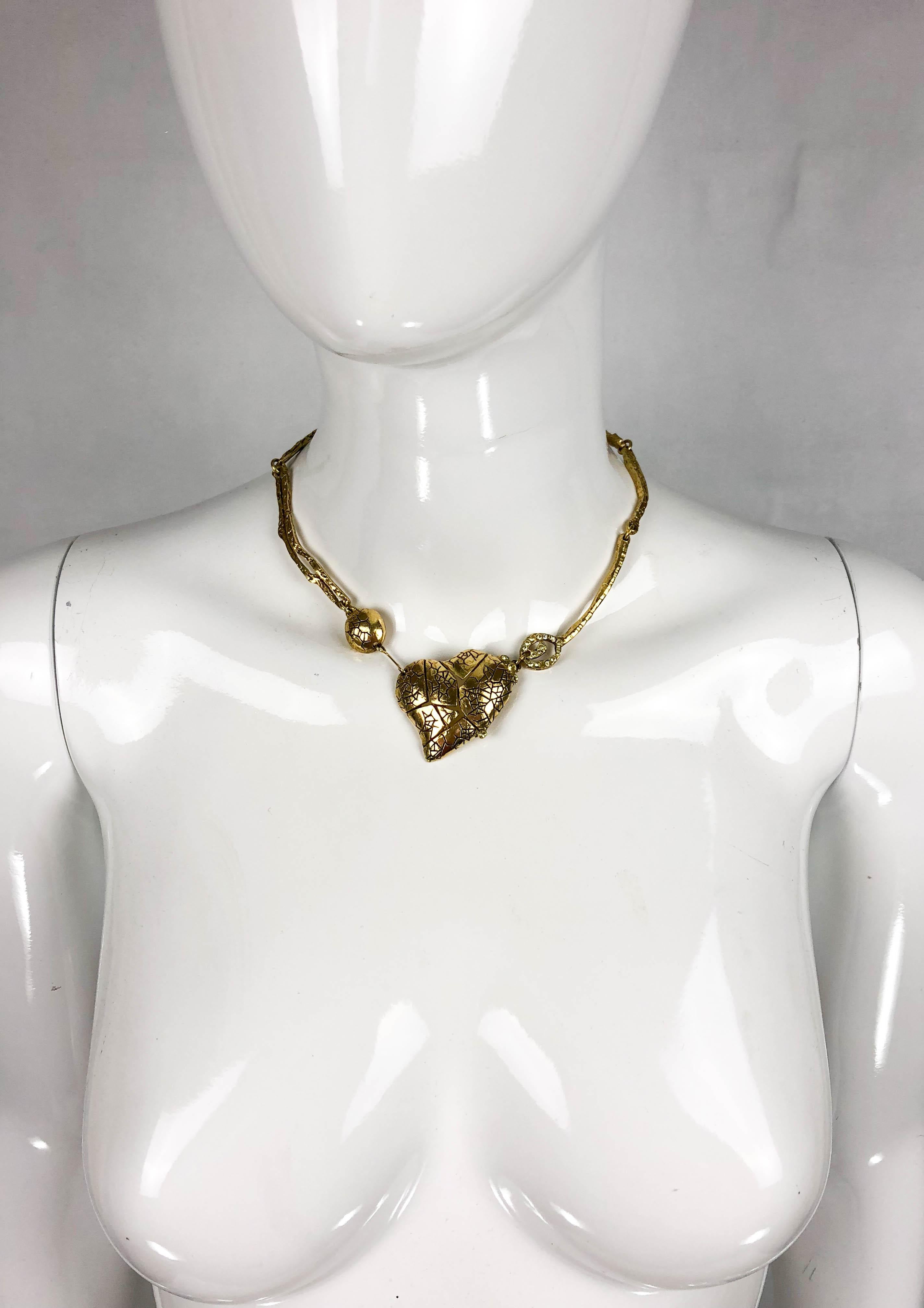 Christian Lacroix Gold-Plated Heart Necklace. This beautiful piece by Lacroix dates back from the 1990’s. Made in gold-plated metal and with an organic feel to it, it has the heart its main feature. Bringing in the quirkiness that Christian Lacroix