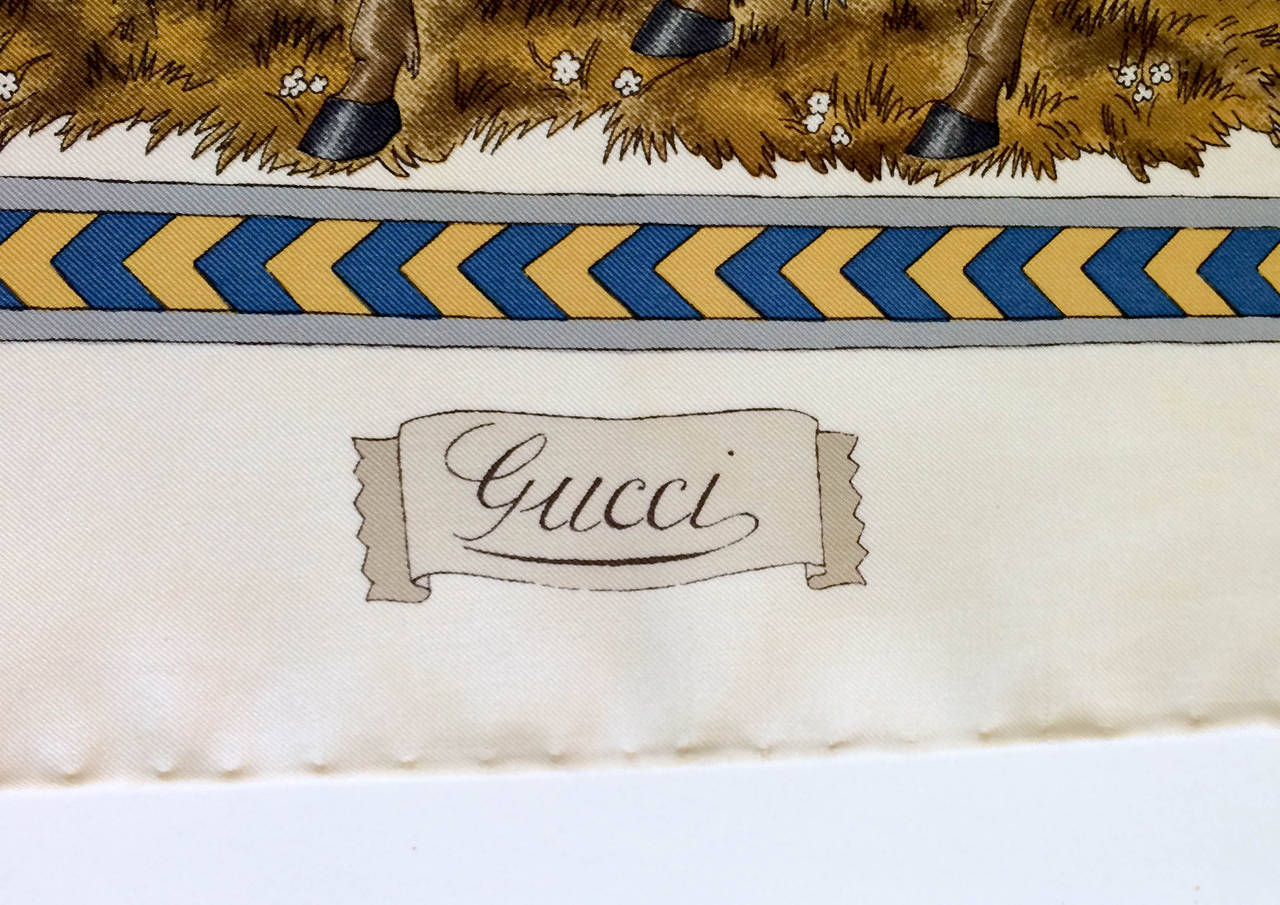 Beautiful Vintage Gucci Scarf, designed by Italian artist Vittorio Accornero. Gucci and the artist had a very successful collaboration in the 60s and 70s. Medieval theme. Beige/cream background with bold, vibrant colours. This is a rare and stunning