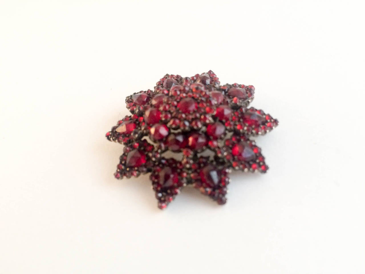 Stunning Garnet Brooch dating back from the 19th Century, circa 1860. Stones are beautiful with a very deep red colour. 

STYLE: Victorian

CONDITION: Pristine (please refer below to condition chart for more information)

ORIGIN: Bohemian