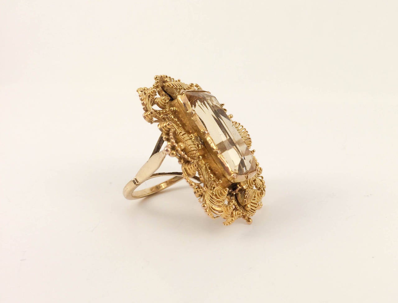 Ravishing Antique Gold and Citrine Ring. Truly stunning brooch conversion ring featuring a large rectangular citrine and gold with amazing filigree work (shank is modern). This statement ring with intricate work will add glamour to any outfit. Real