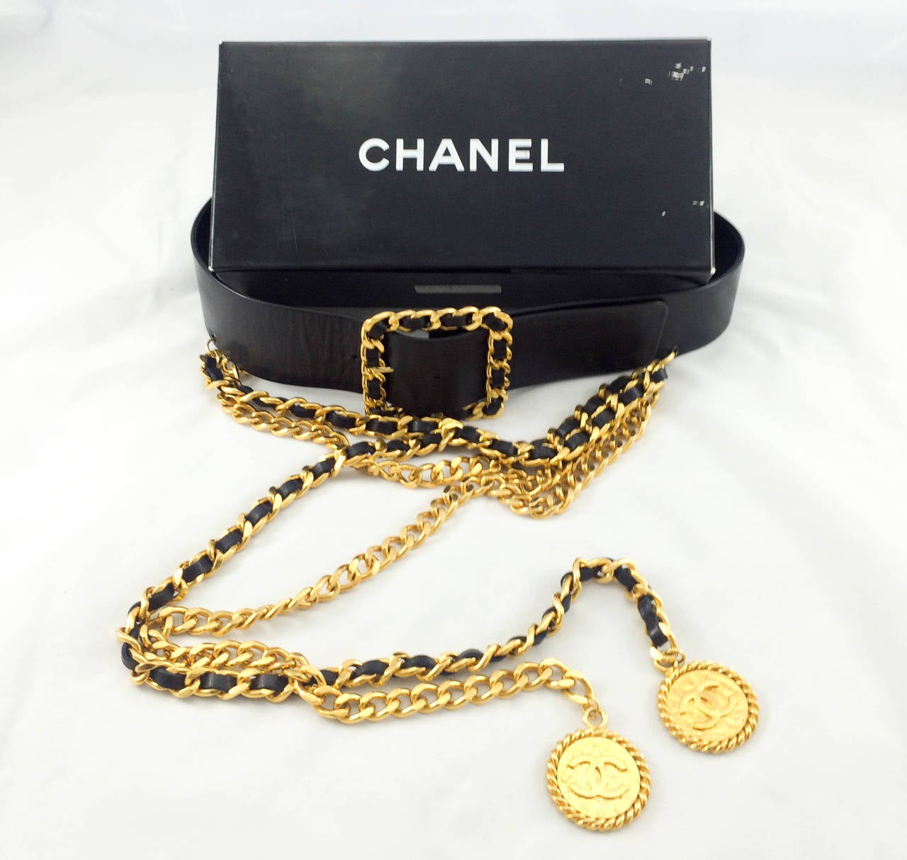 Stylish Vintage Chanel Belt. This super sexy Chanel belt is made of black leather and gold tone metal. Created by the super jewellery designer Victoire de Castellane, it features a fabulous chain embellishment on the front comprising of 2 gold tone