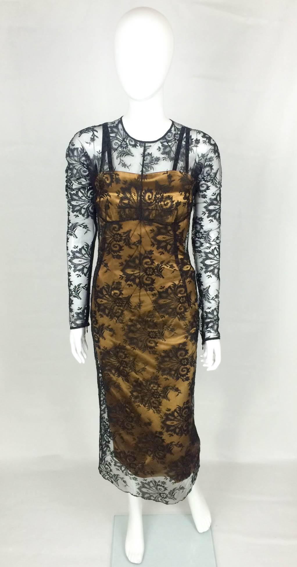 Gorgeous Dolce and Gabbana 2-Piece Dress. This sexy dress is made of two pieces: the underneath bronze sheath dress (fitted, body-hugging) and will accentuate the curves and give a great silhouette (lined); on top, the long sleeves black lace brings