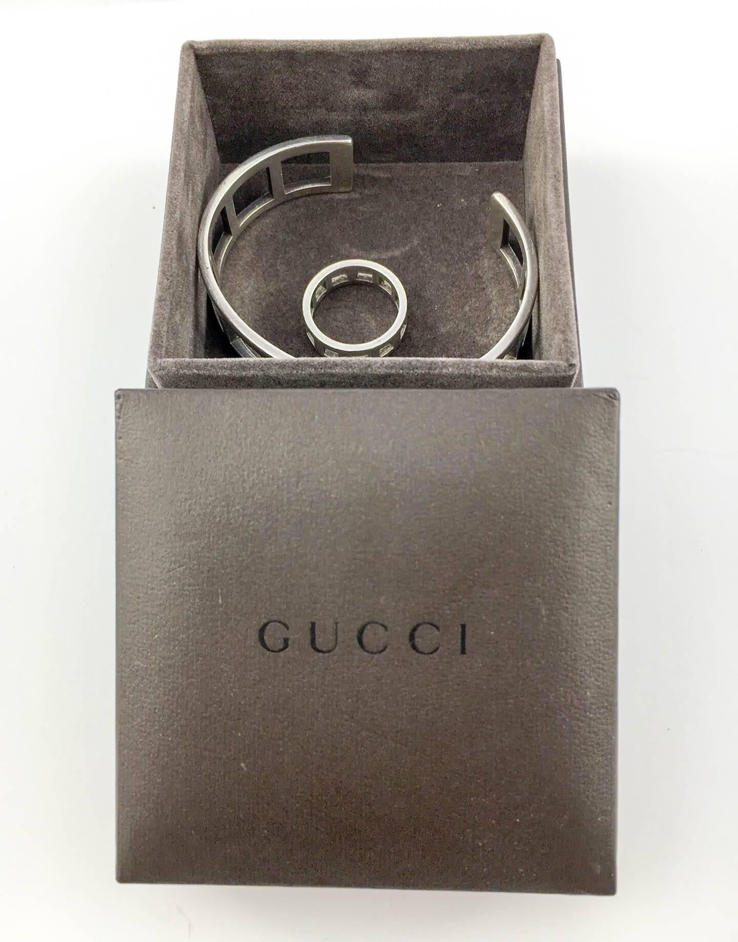 Smart Gucci Silver Set. In sterling it comprises of a ring and bangle. The geometric design is simple, yet elegant, with cut-out squares. Gucci signed and hallmarked, this set comes in the bracelet’s original box (no ring box). These are stylish and