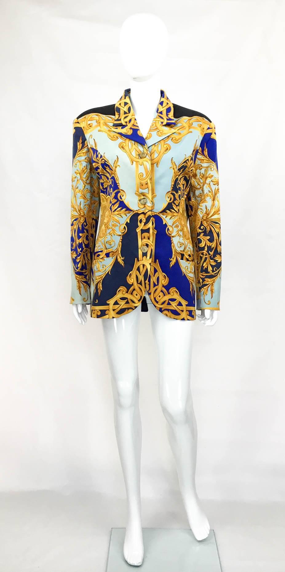 Vintage Versace Baroque Print Jacket. This stunning Versace jacket features 3 elaborate old gold-toned buttons down the front and 2 on the back, as well as two front pockets. The waist is slightly cinched in. Fully lined. The pattern features